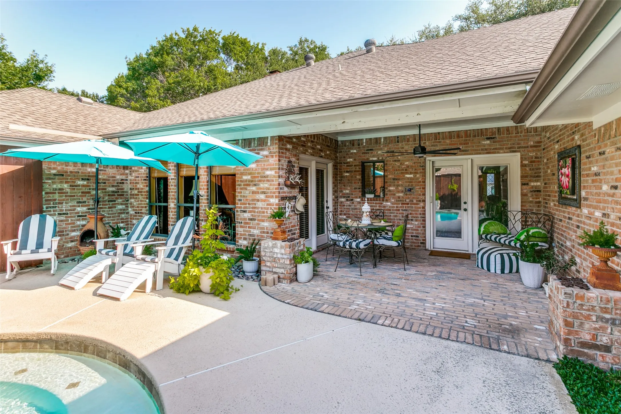 The covered patio is the perfect place to enjoy morning coffee or an evening gathering.