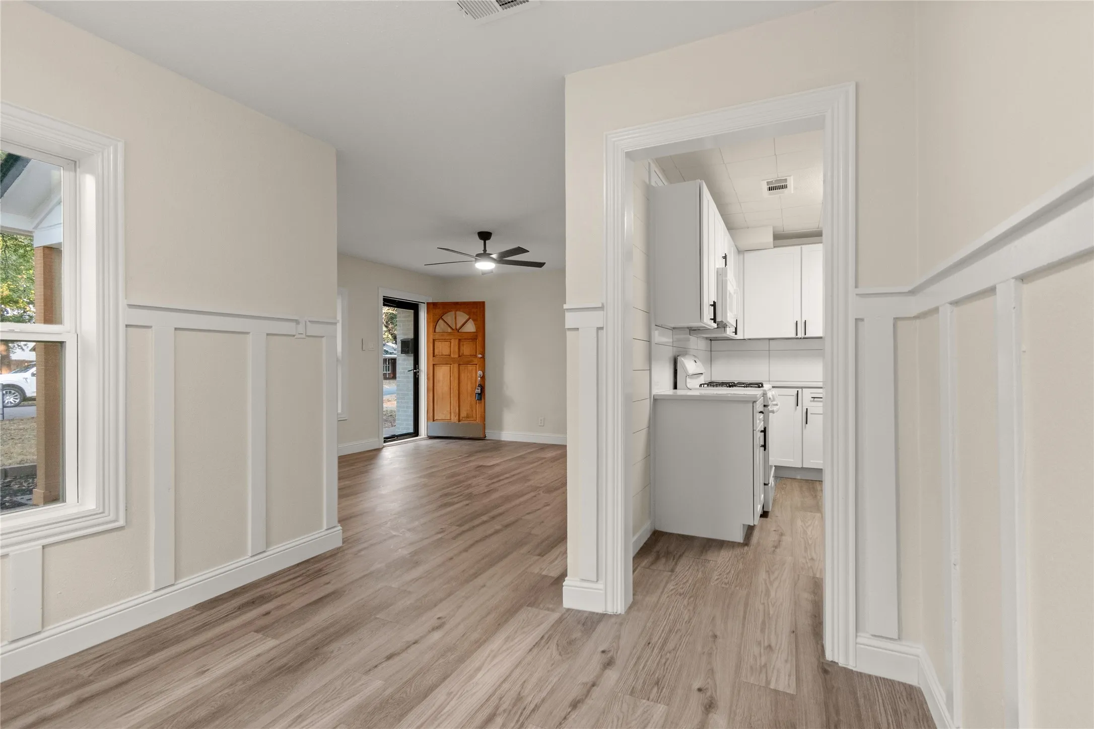 View from the dining room to the living room & the kitchen.
