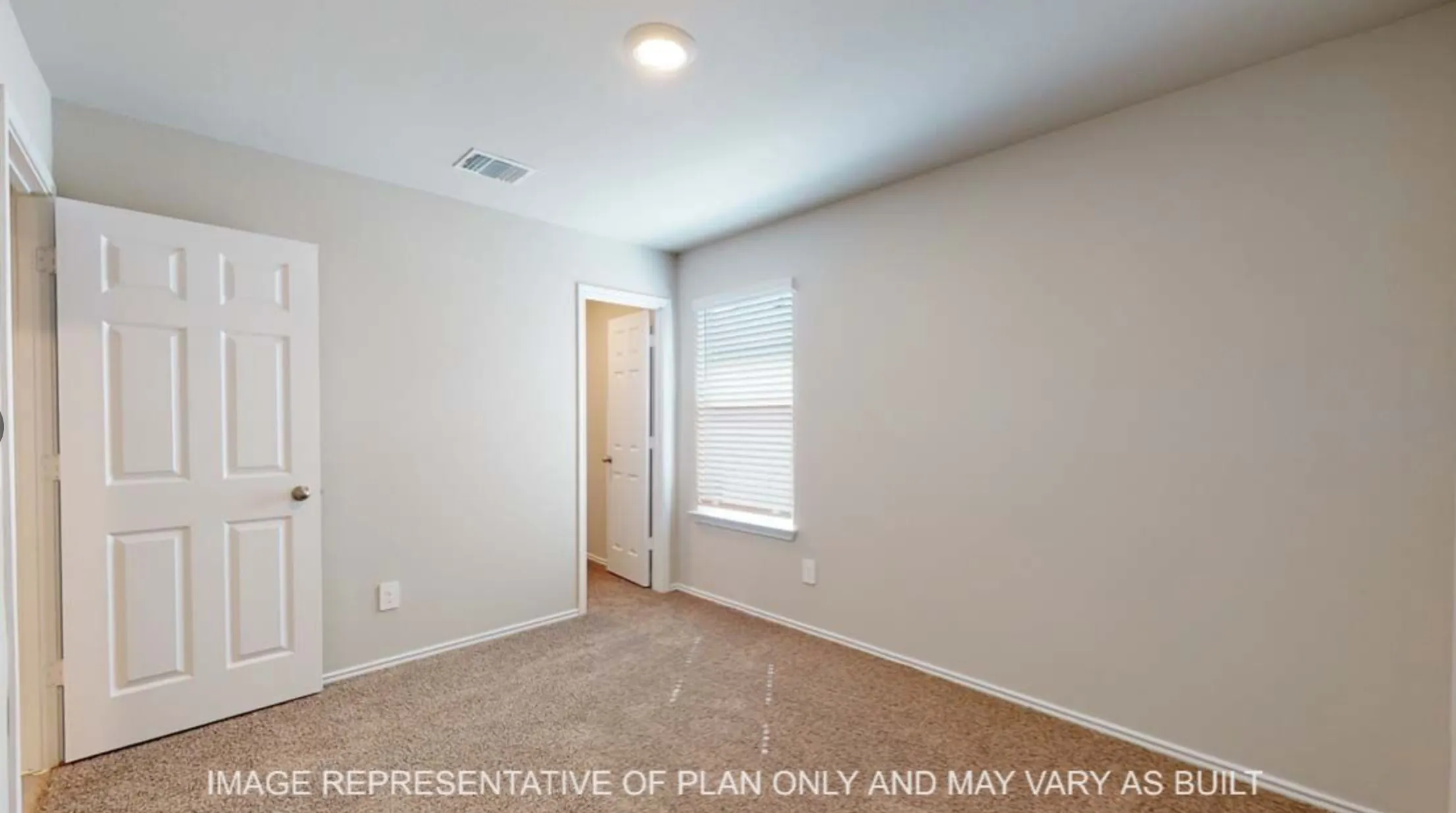 Neutral wall color, carpeted flooring, window with blinds, recessed lighting, six-panel interior door