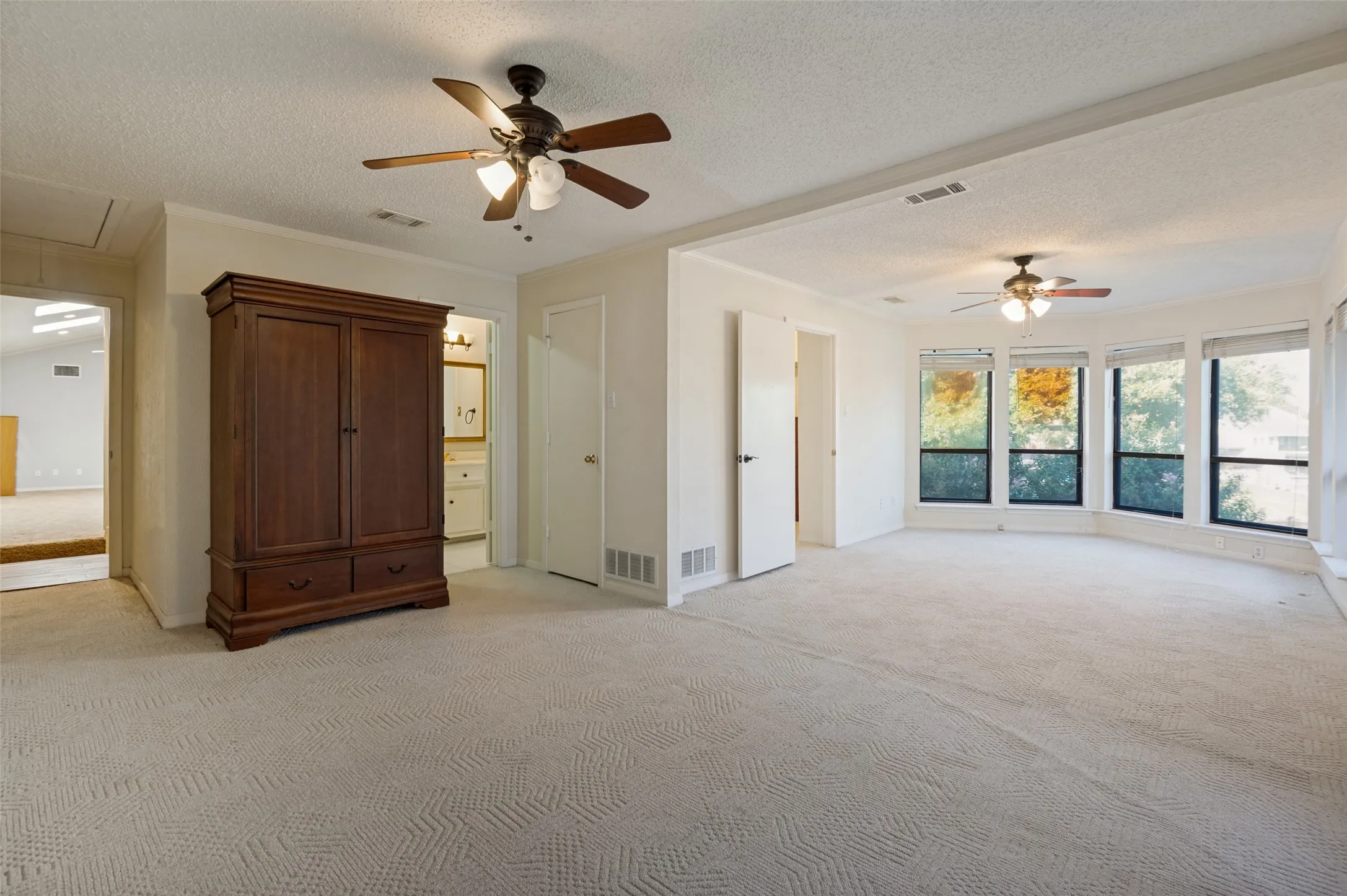 Upstars Primary Suite showcasing sitting area.