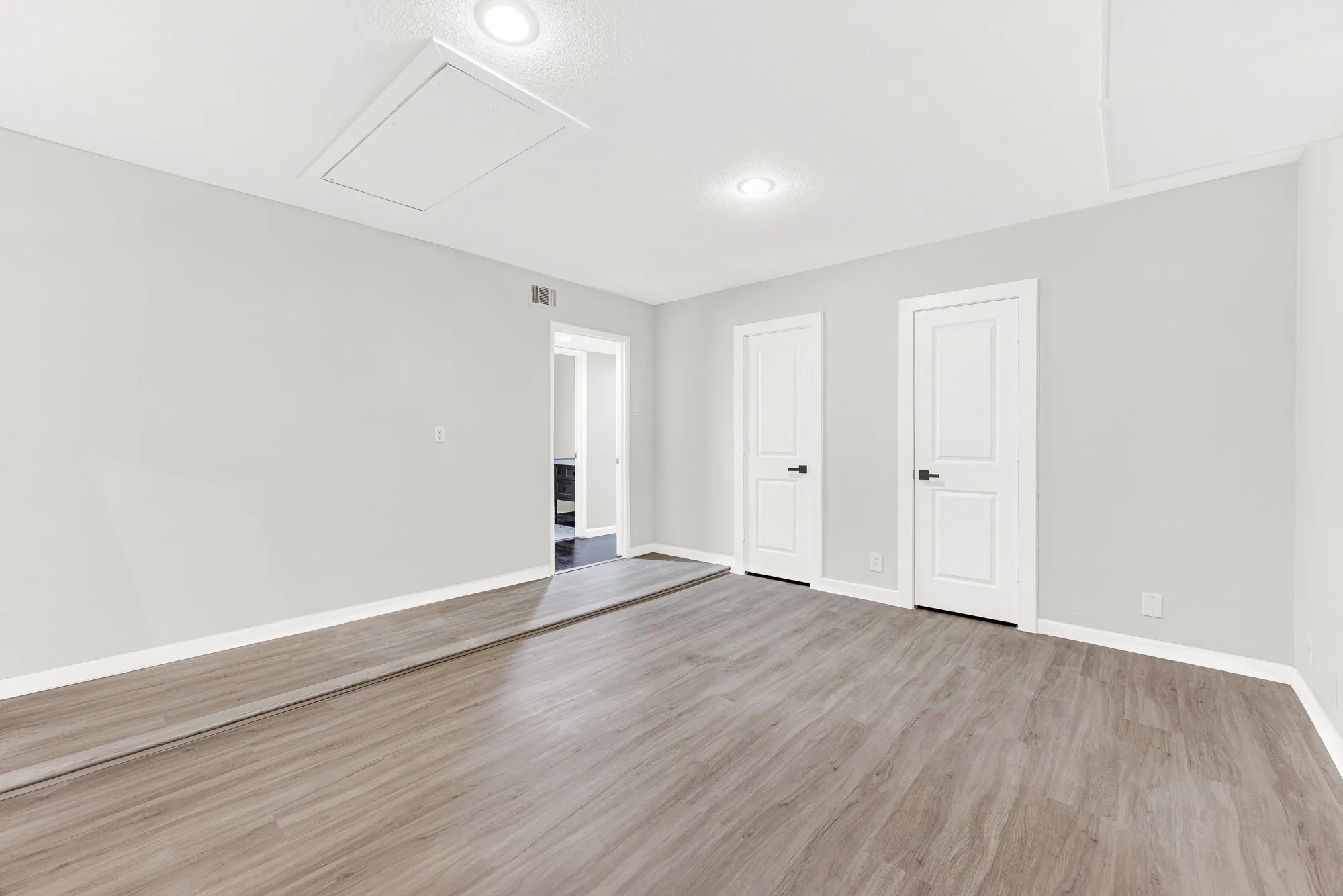 Spacious game room has a huge walk-in closet with access to the outside storage.