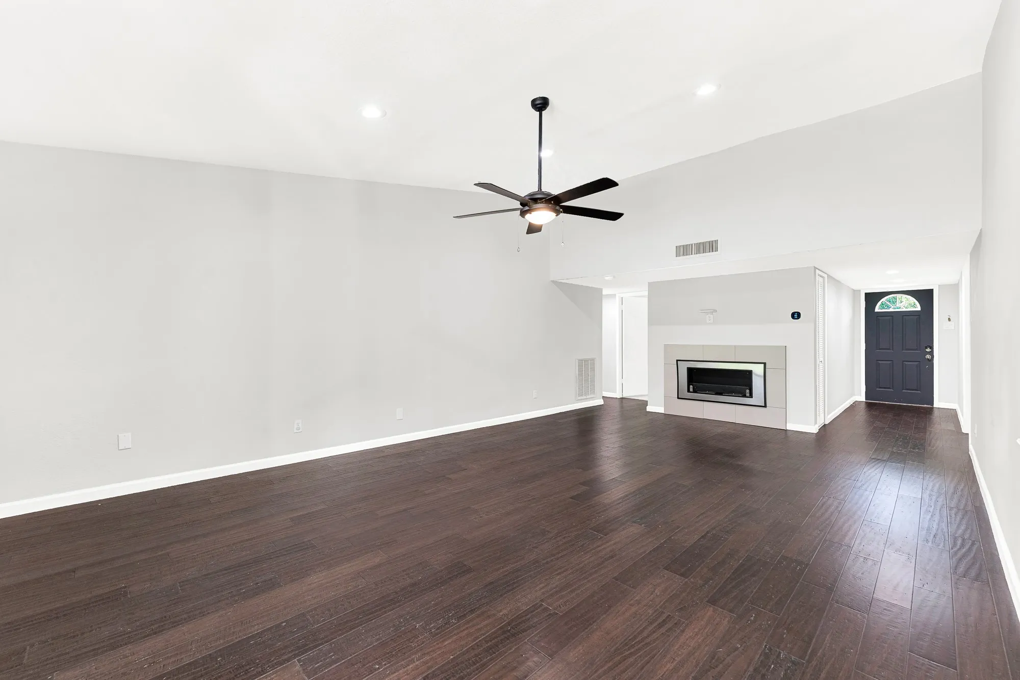 Another view of this spacious living room and fireplace.