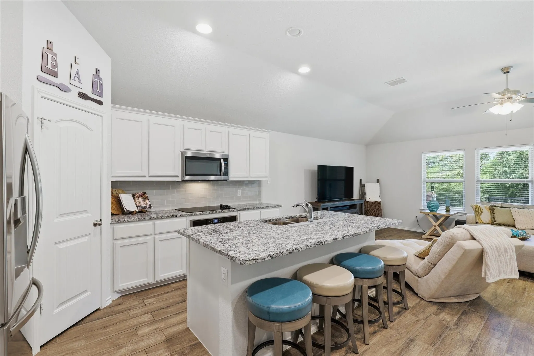 The center Island Breakfast bar is great for prep space and there's even a walk-in pantry.