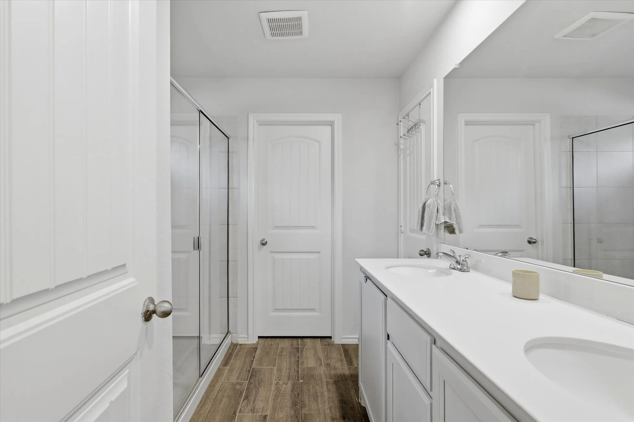 Primary Bath with dual sinks and shower.