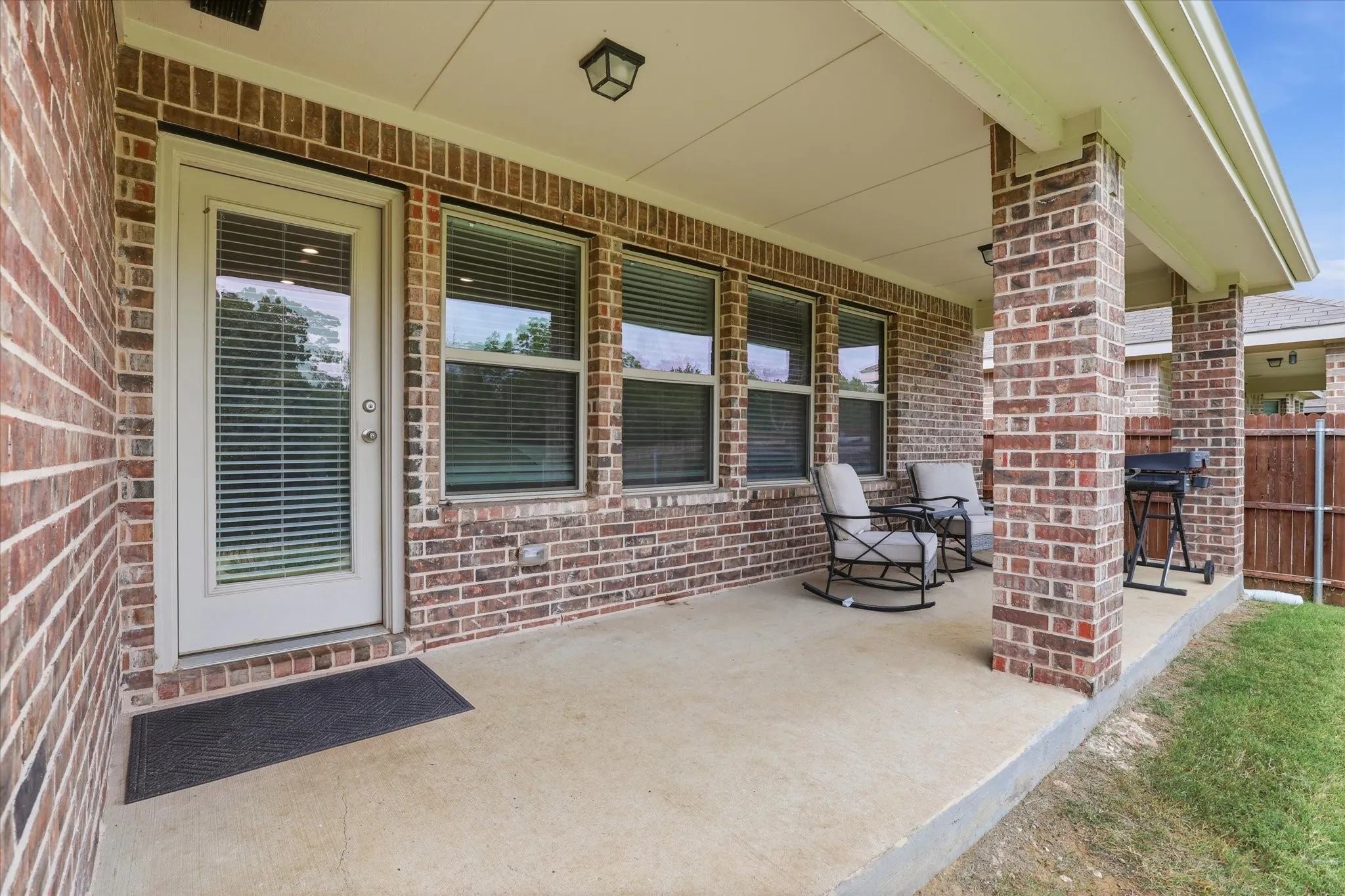 The covered patio is extended for extra space.
