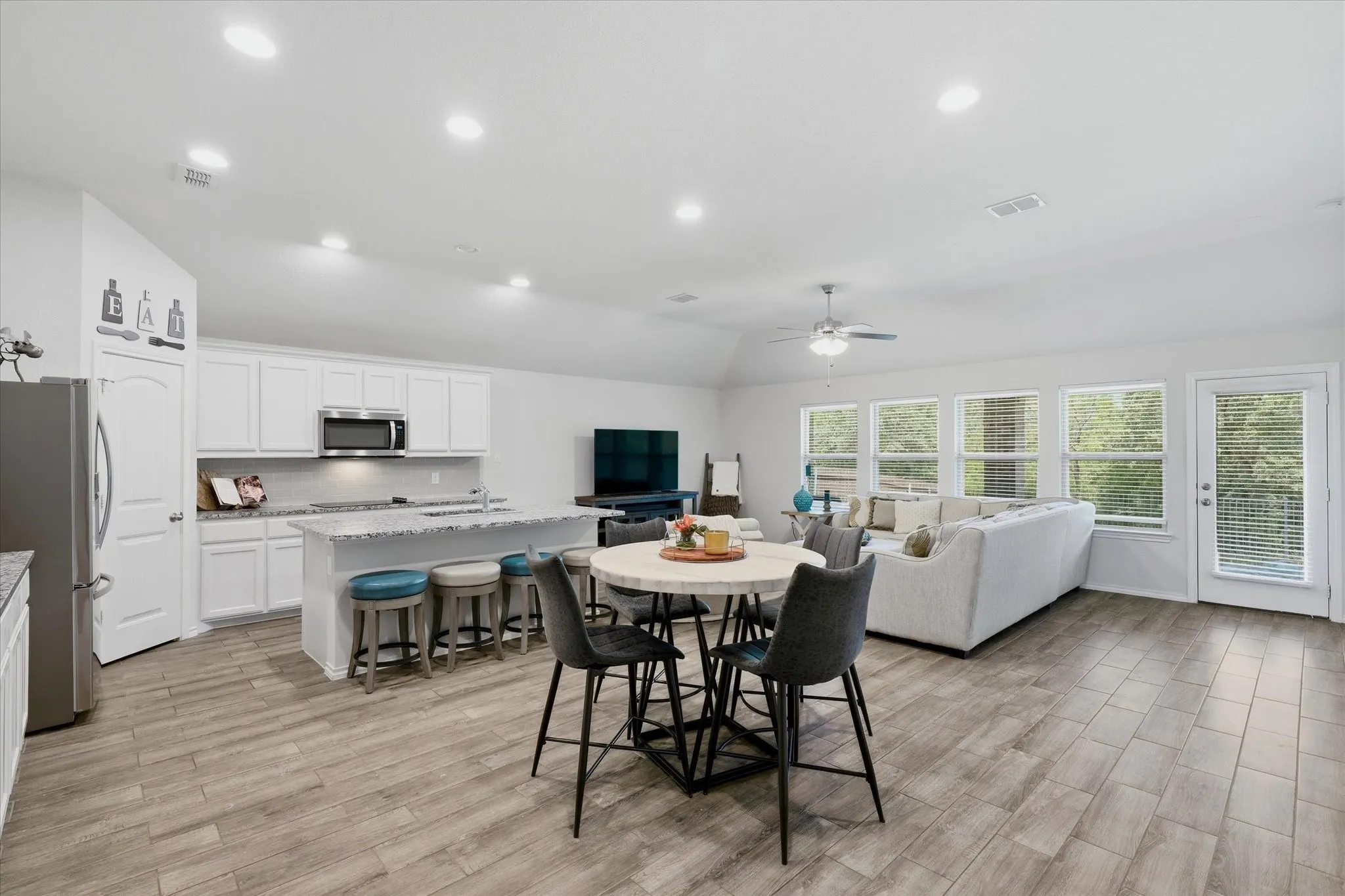 The great room offers a Kitchen, Dining area and Family Room