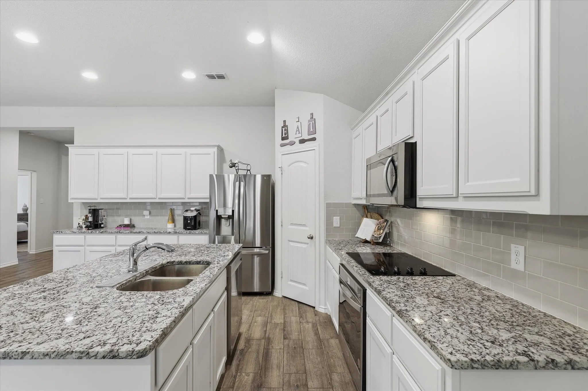 Another Kitchen view showing the additional cabinets and counter-top space.