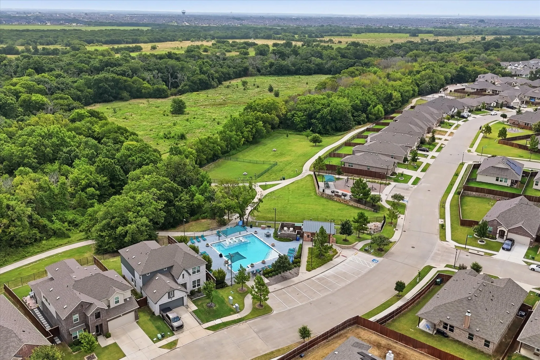 Aerial view of the community pool, playground and more of the nature preserve.