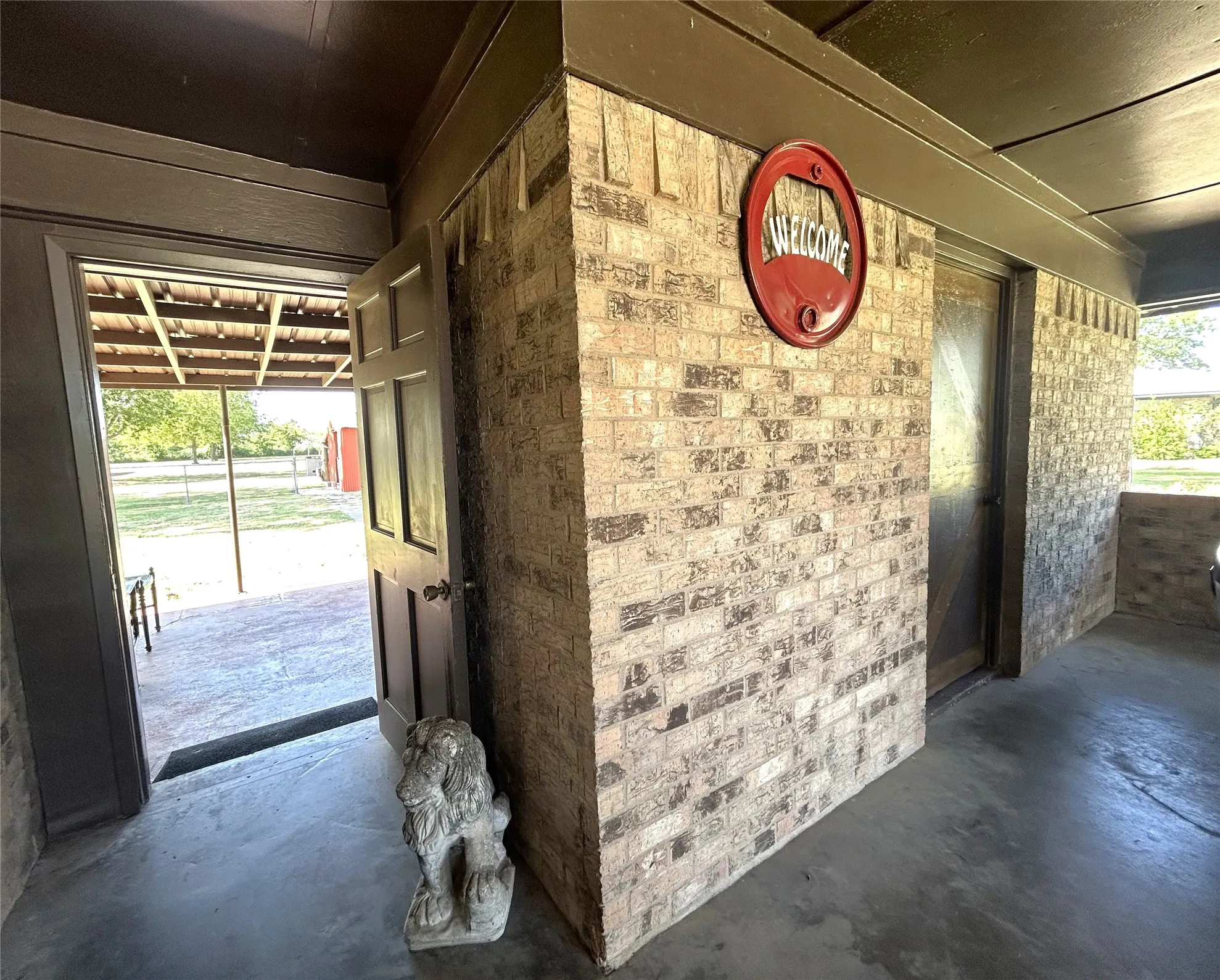 Laundry room off the carport and door to the covered back porch area