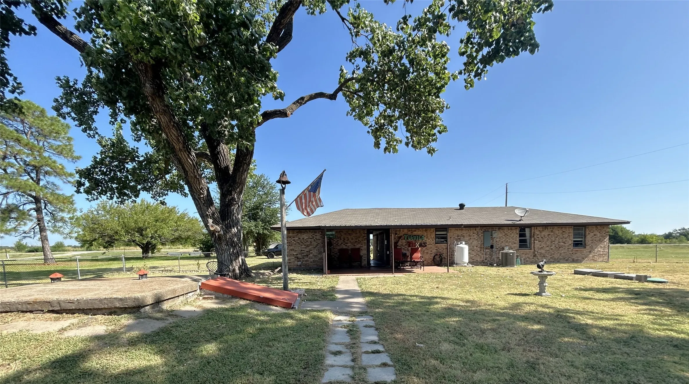 View from the yard fence to the back of the home