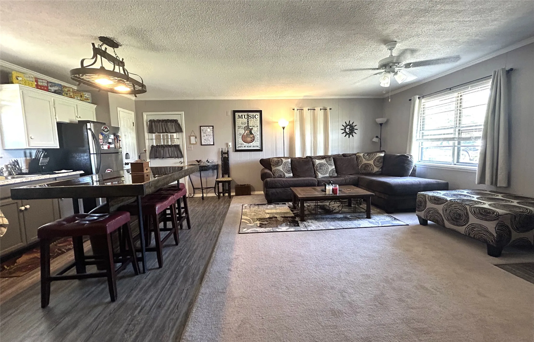 Open concept living room, dining area and kitchen