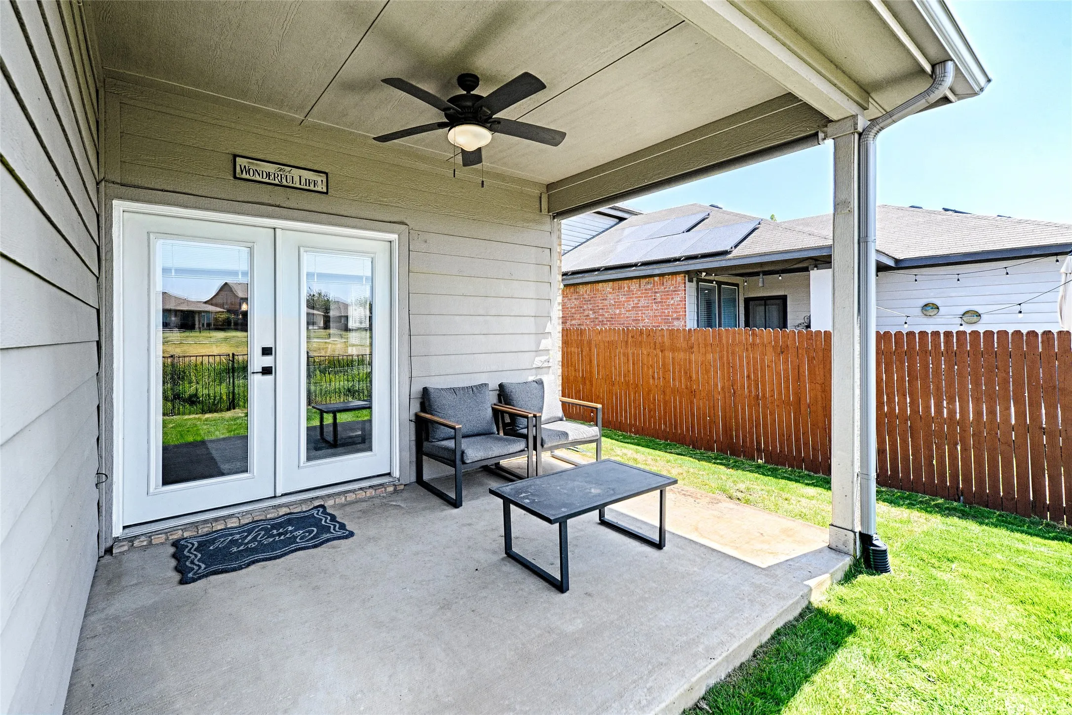The back covered patio has room for more furniture and a grill. There is a pull-down screen to the side for extra privacy or shade from the morning sun.