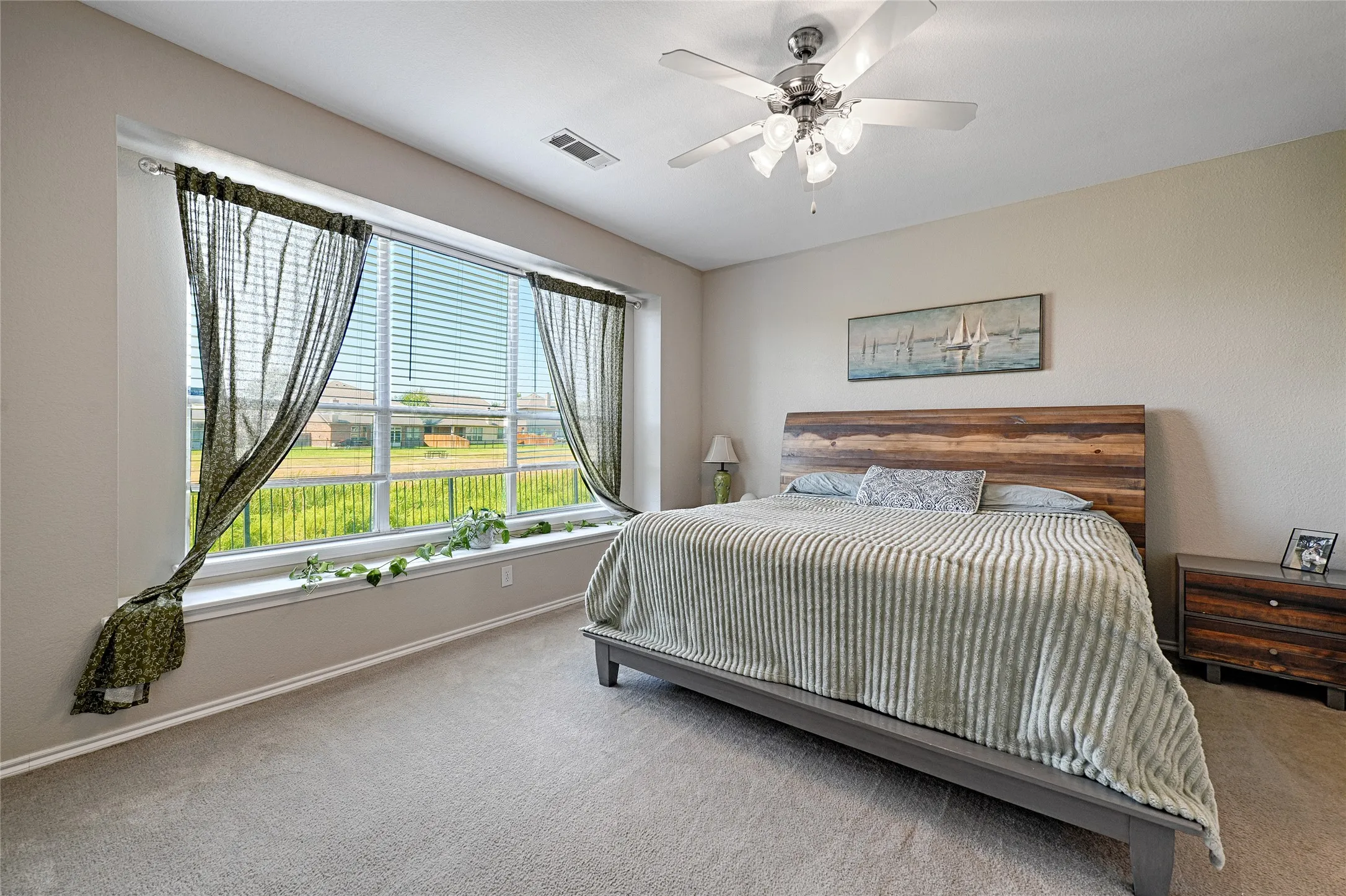 Spacious and bright with natural light. This room also has a deep window ledge for plants, sitting, or all those extra pillows!