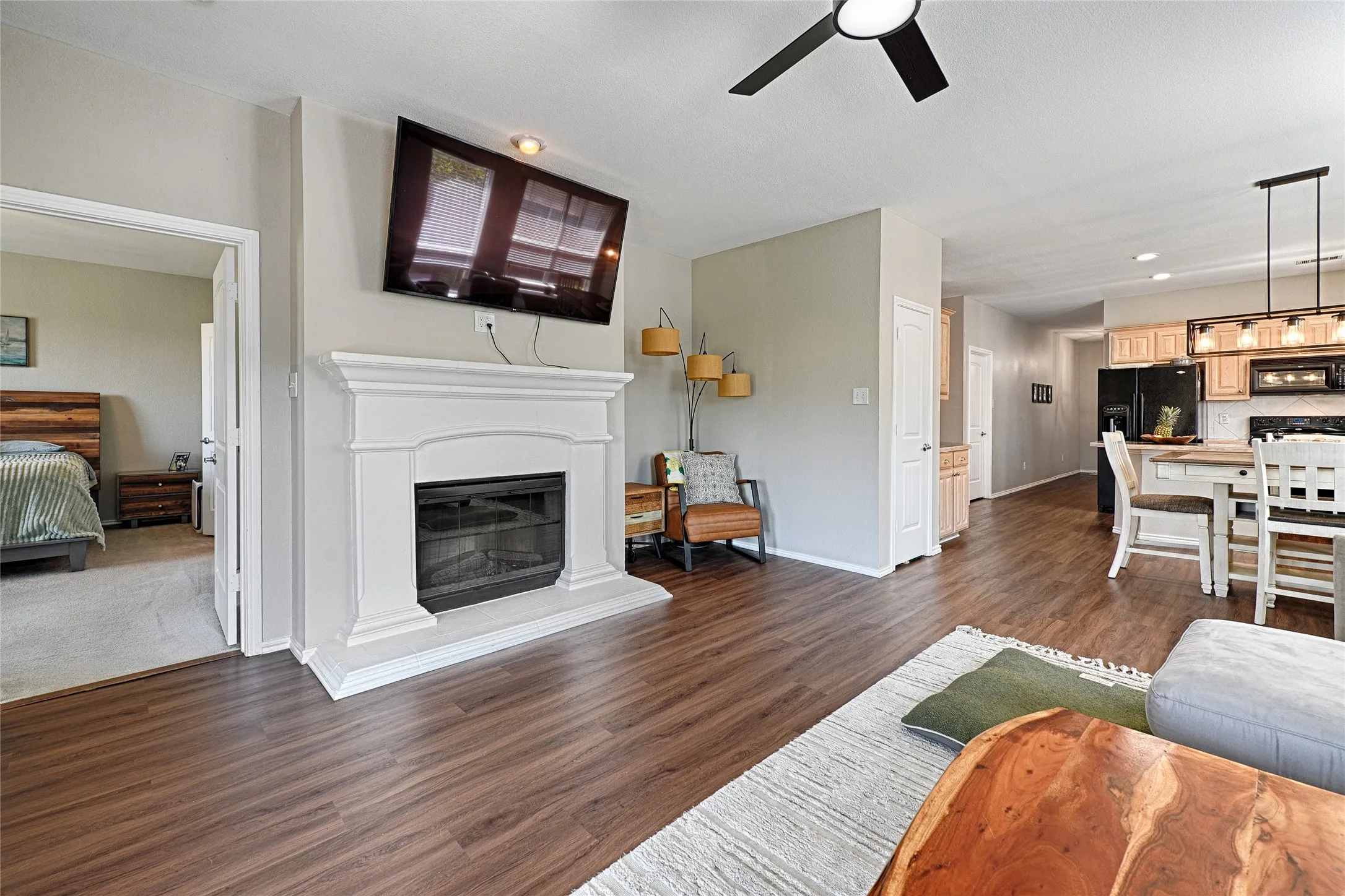 The fireplace adds a nice touch to this living room, along with the reading nook created by the homeowner.