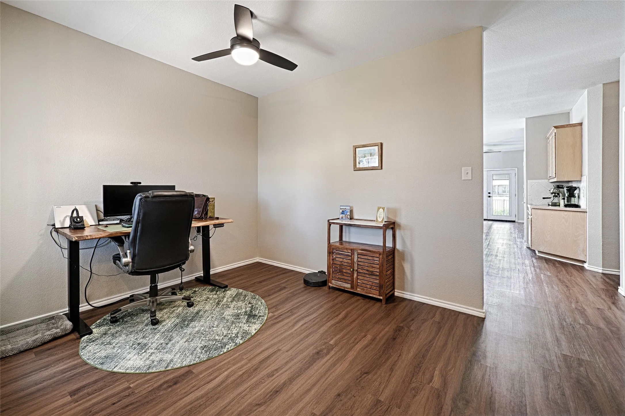 This smaller living area has been used as an office by the homeowner. Ample room for seating too.