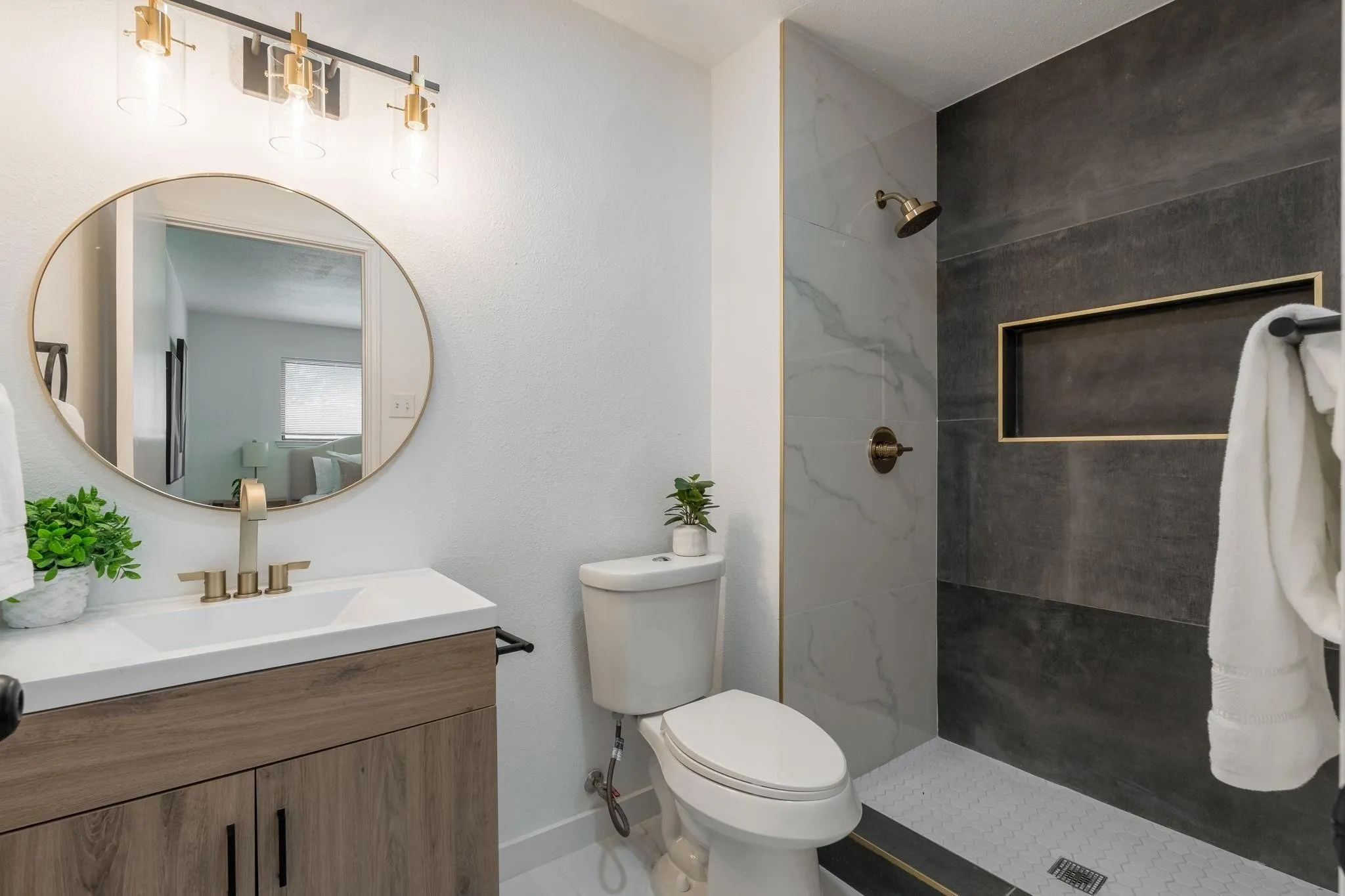 Wood-finish vanity with a white countertop and rectangular sink