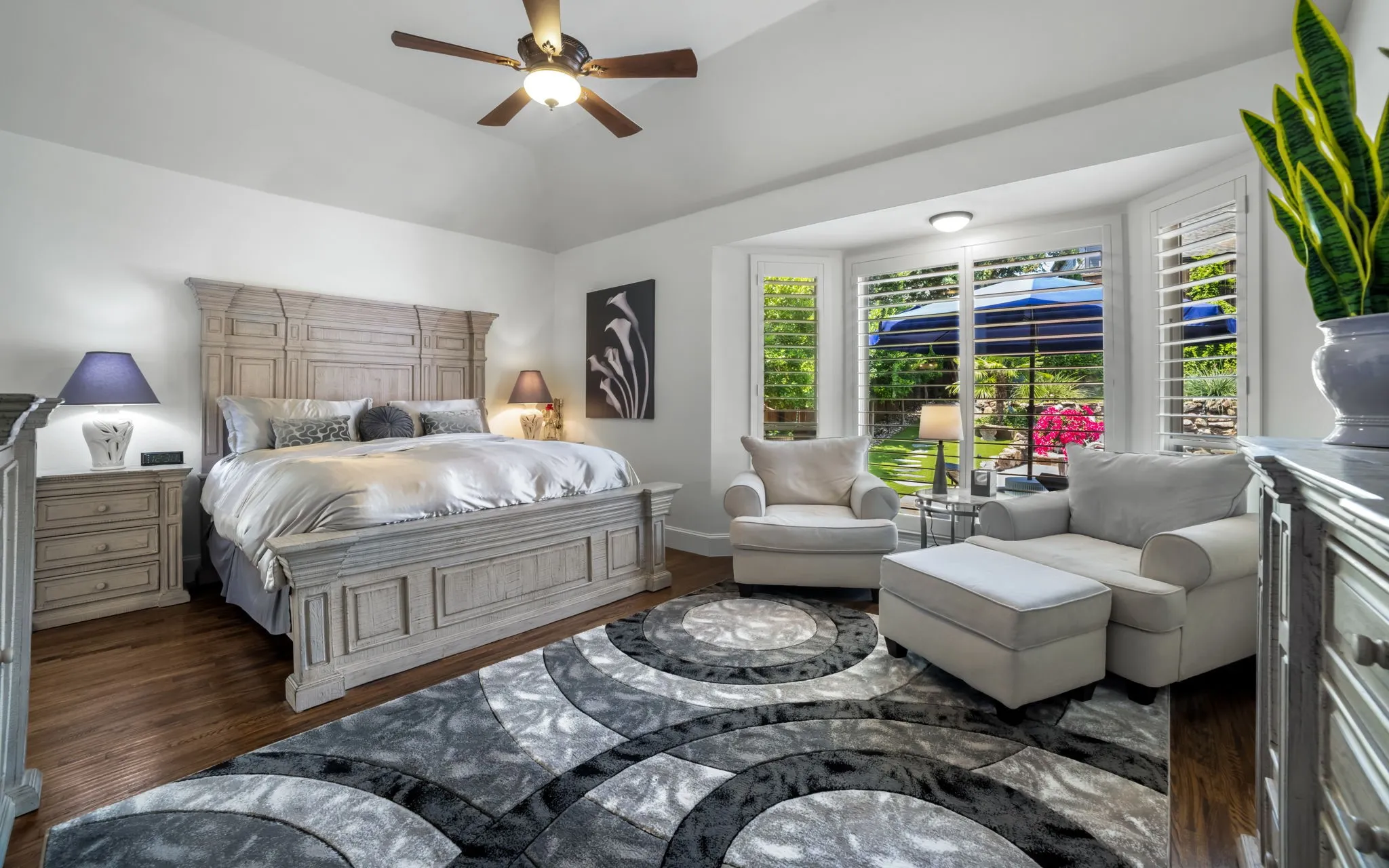 Large primary suite overlooks the backyard and has room for a sitting area.
