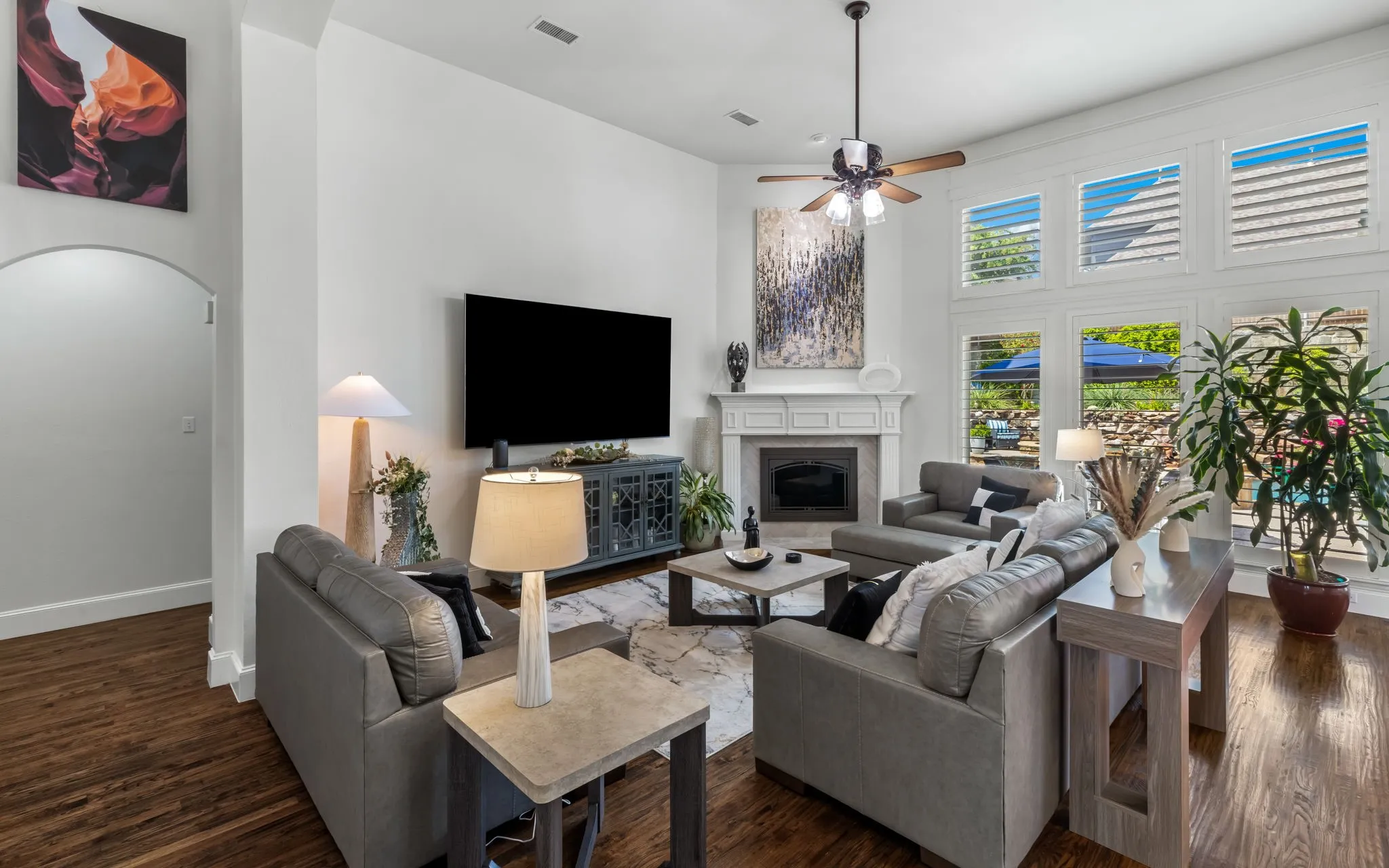 The living room has fabulous views of the amazing back yard!
