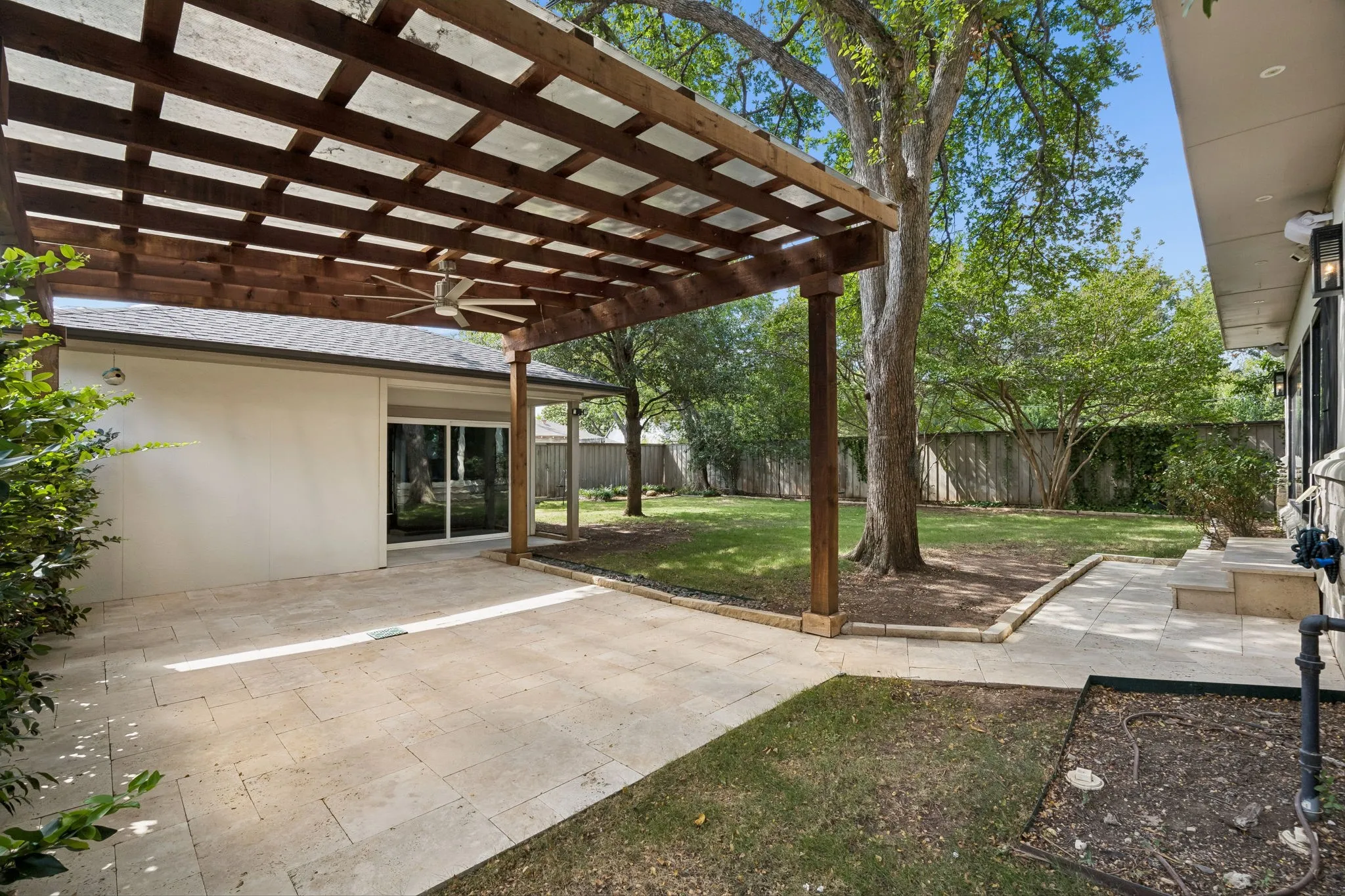 Covered pergola attached to the garage.