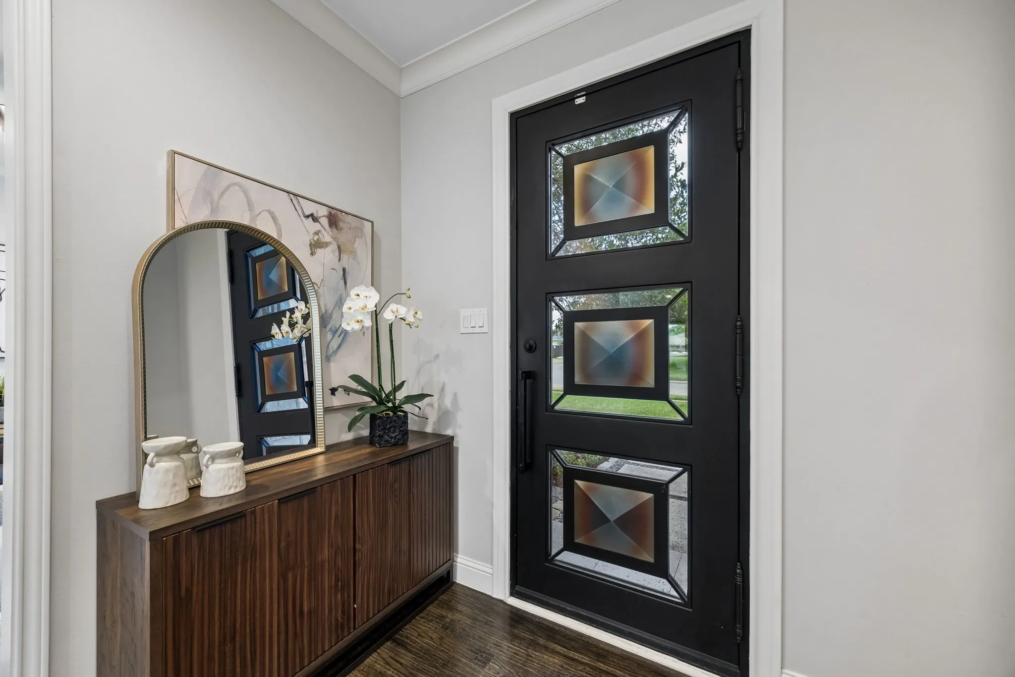 Entrance with beautiful custom door.