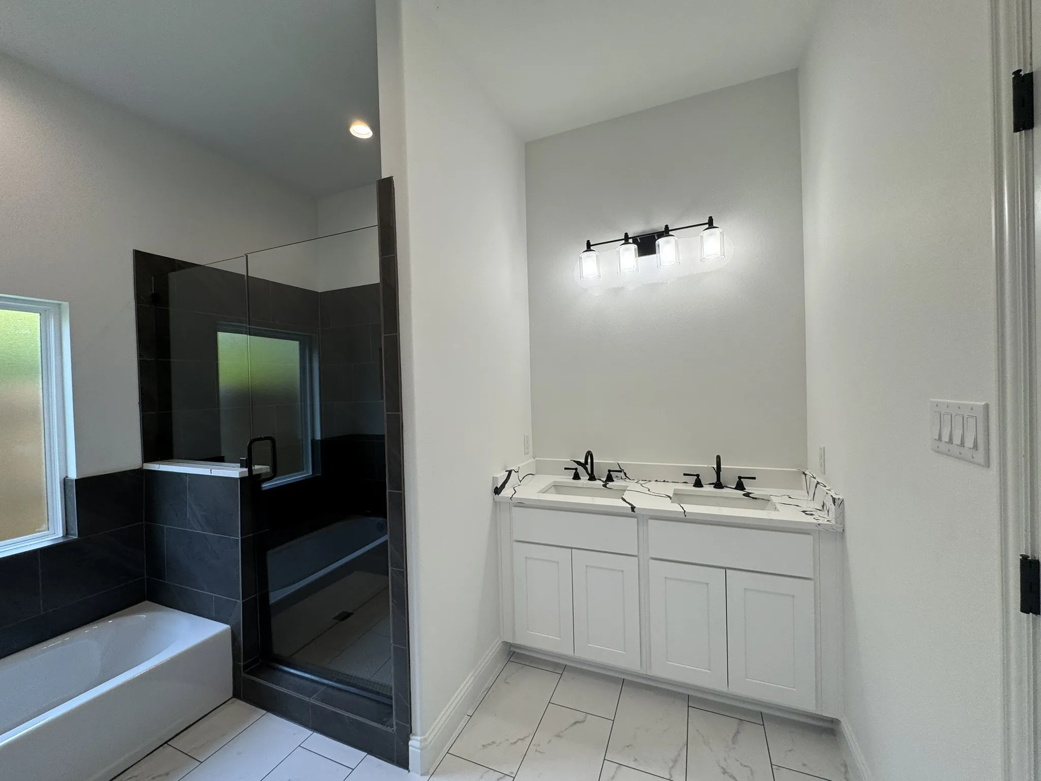 Dual vanity with undermount sinks and matte black fixtures