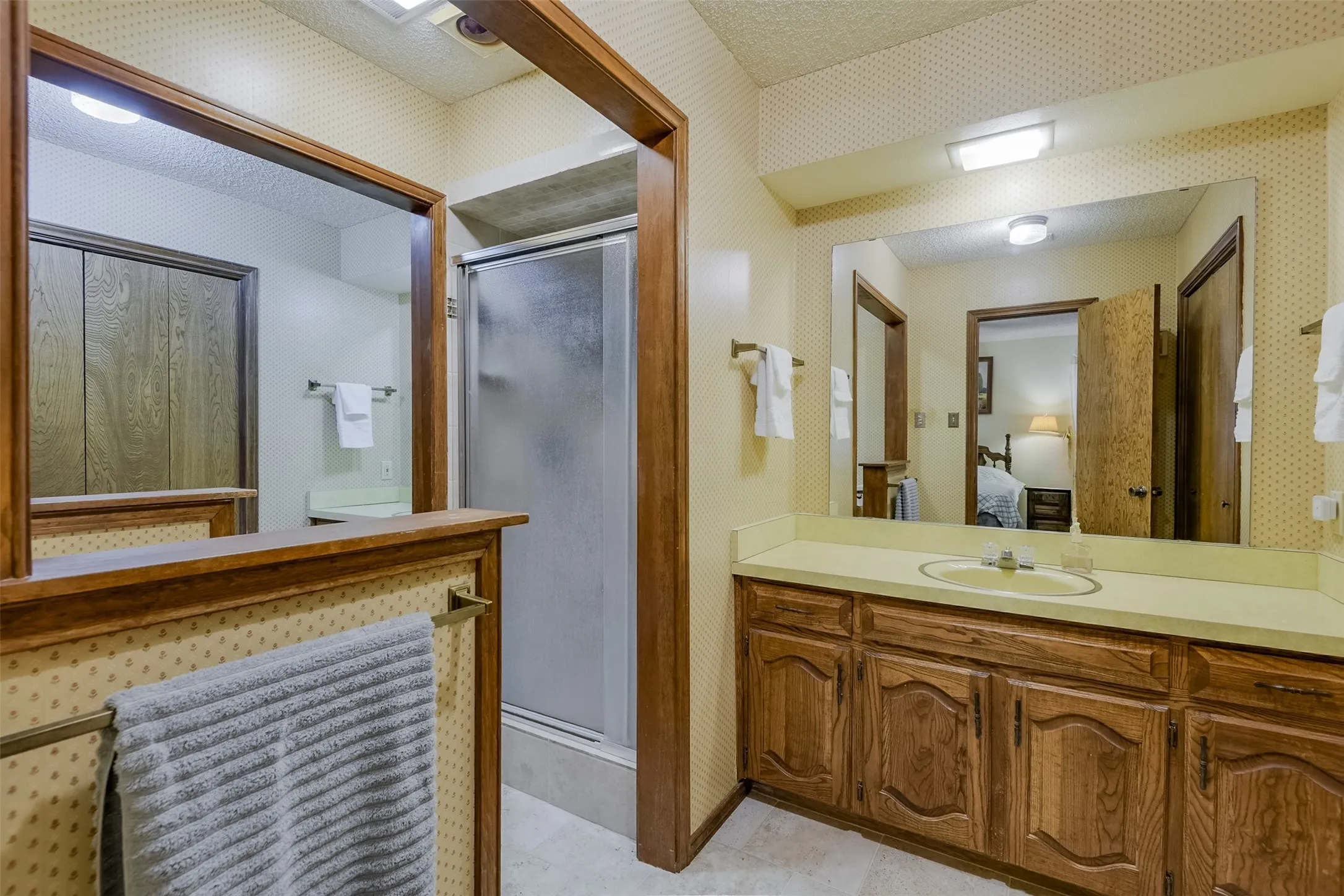 Additional view reveals that each private dressing area is paired with its own walk-in closet, adding to the incredible amount of storage.