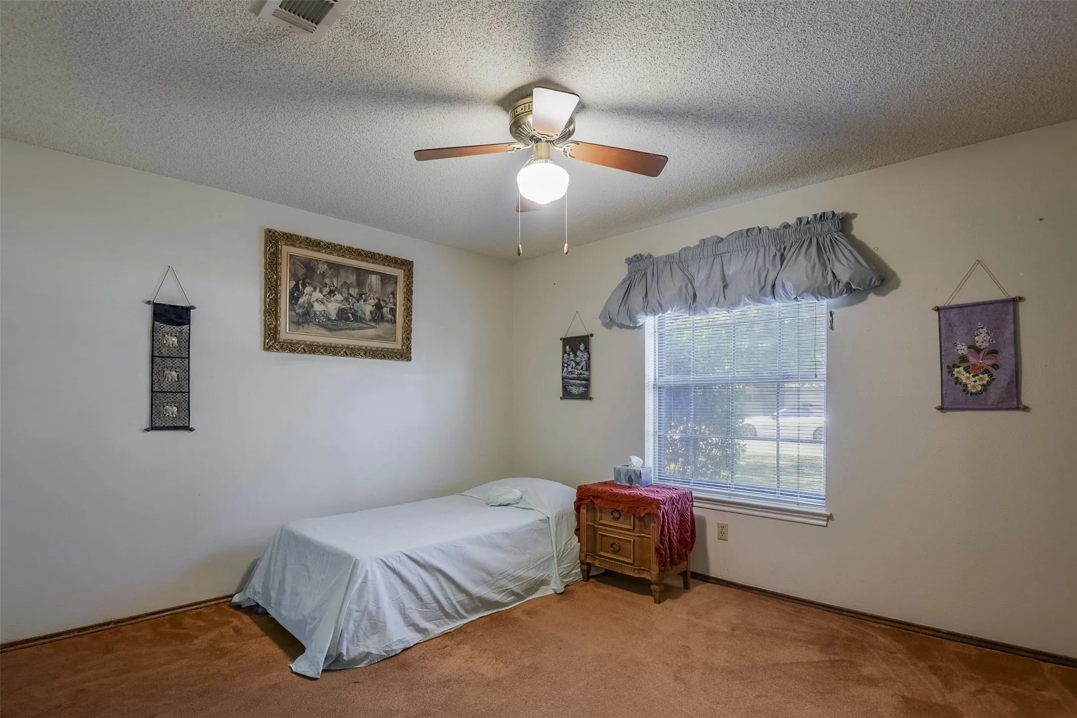 In keeping with the rest of the home, this companion bedroom boasts of plenty of natural light and room to create a comfortable retreat for a child of any age.