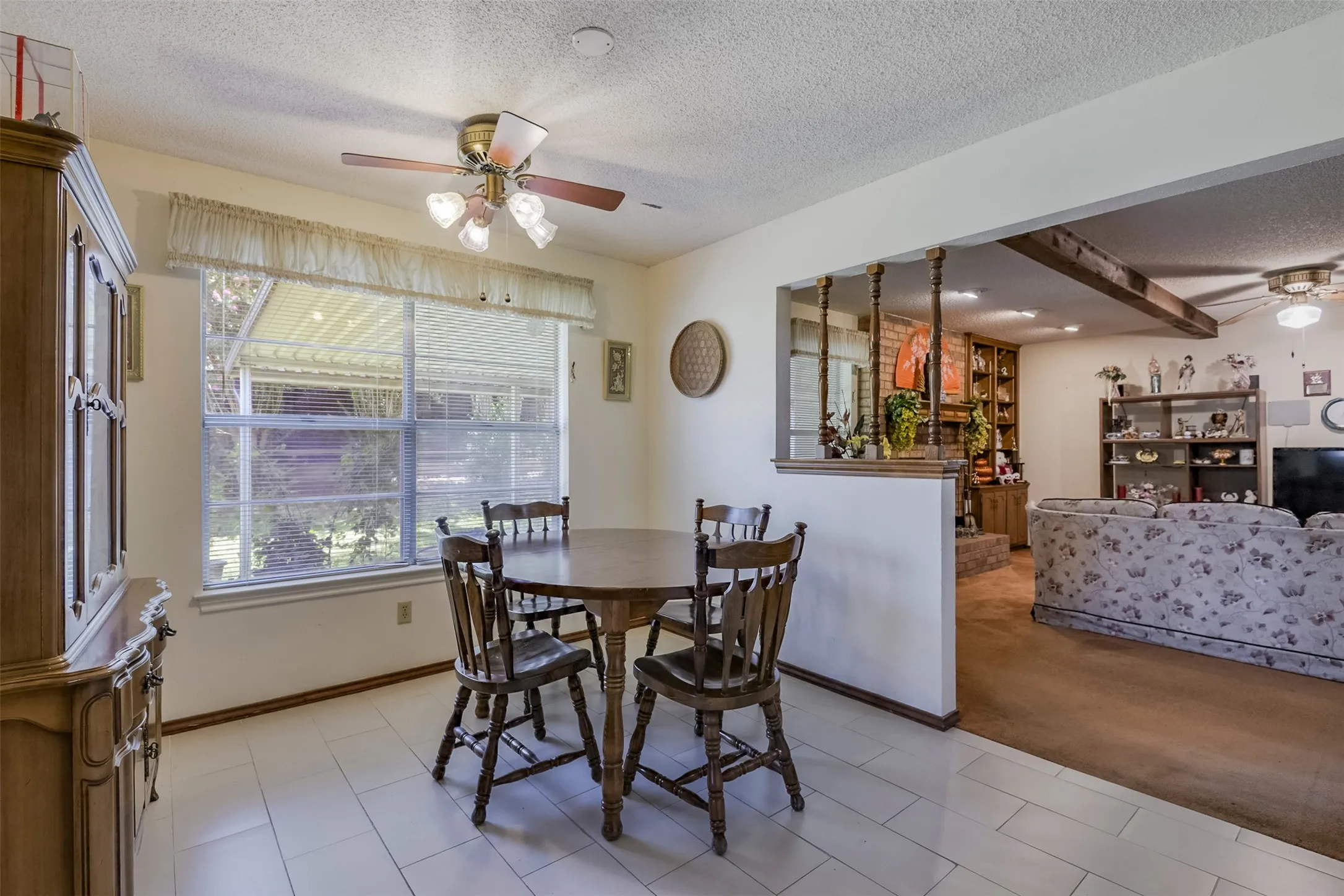 Bathed in natural light from the dual windows overlooking the private back yard, this flexible dining area is perfectly suited for intimate family dinners or larger festive gatherings.