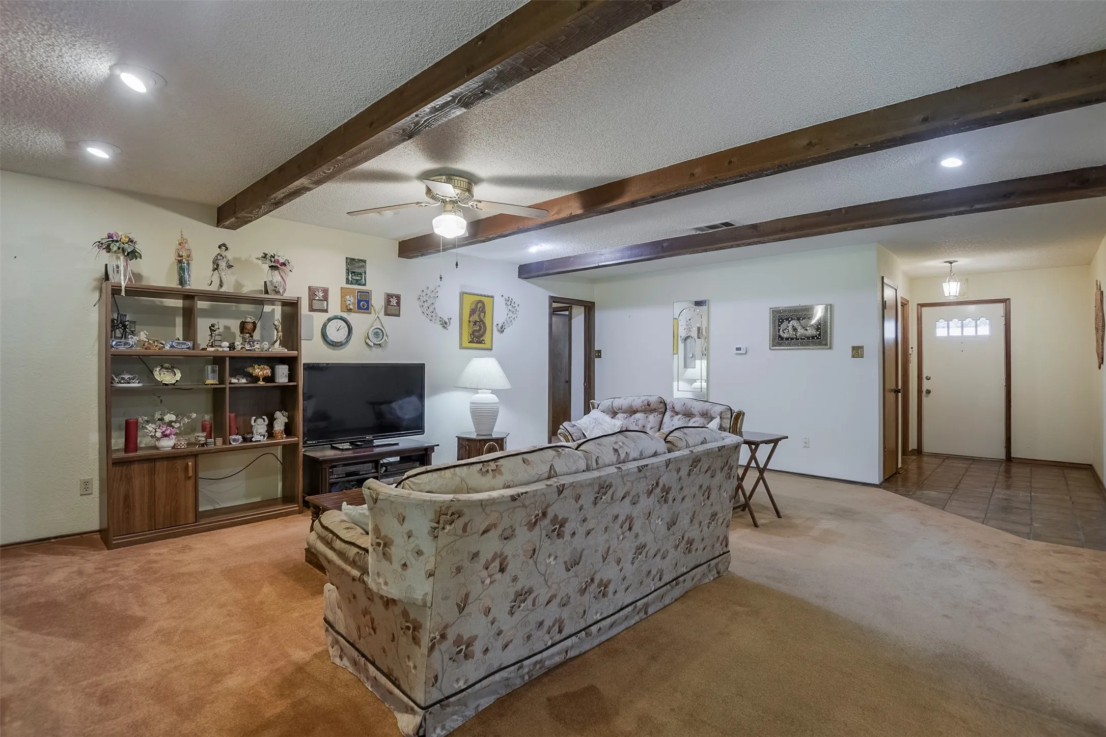 Opposite view reveals a gracious, spacious entry complimented by two large closets providing exceptional storage.