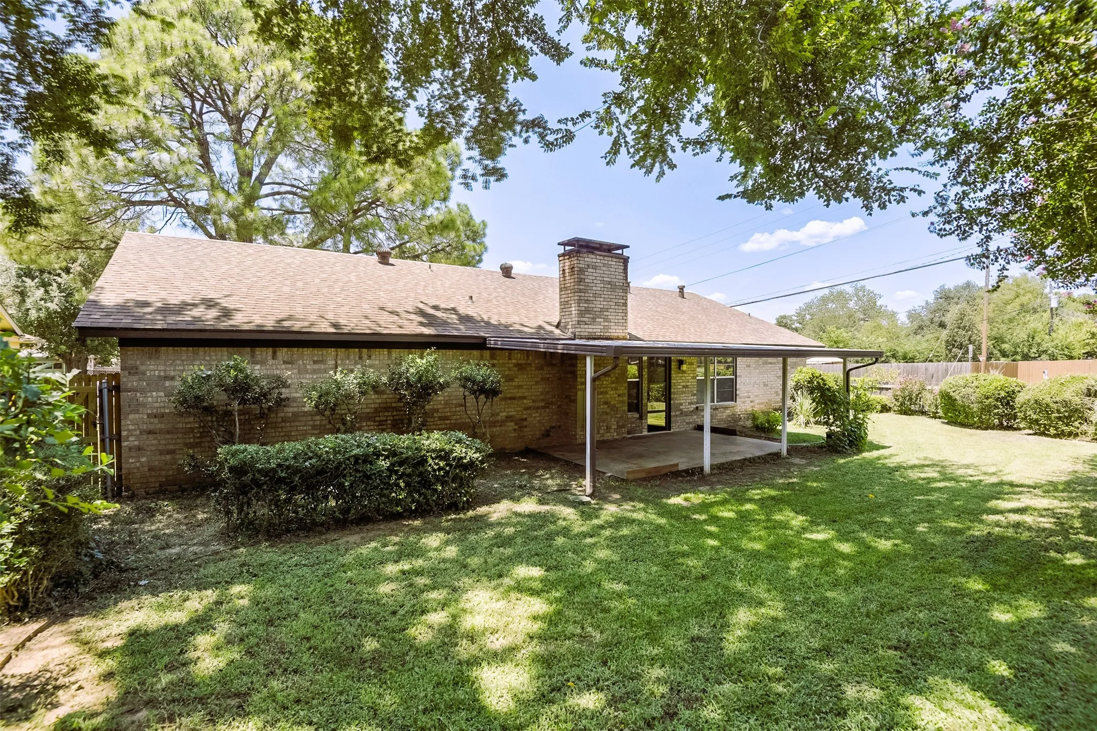 Generous back yard and mature shade trees combine to create a peaceful setting for outdoor living.  There's ample room for the kids and family pets to run and play while enjoying the great outdoors.