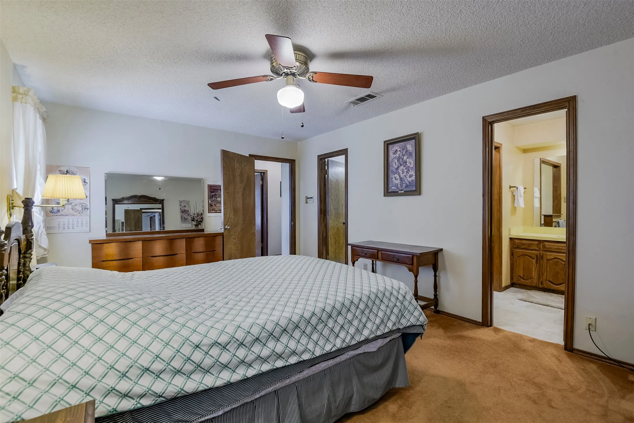 Reverse look showcases the bedroom's generous proportions and highlights its versatility.