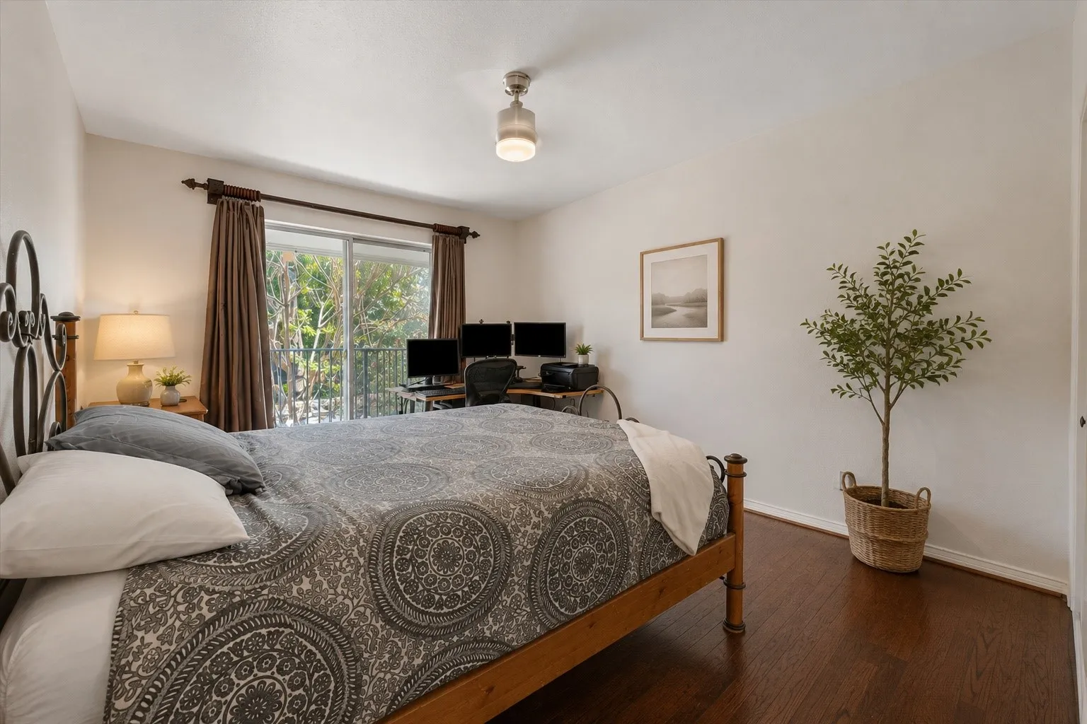  Virtually Staged Wood-finish flooring, sliding glass door, private balcony with metal railing, recessed lighting, and a contemporary ceiling fixture