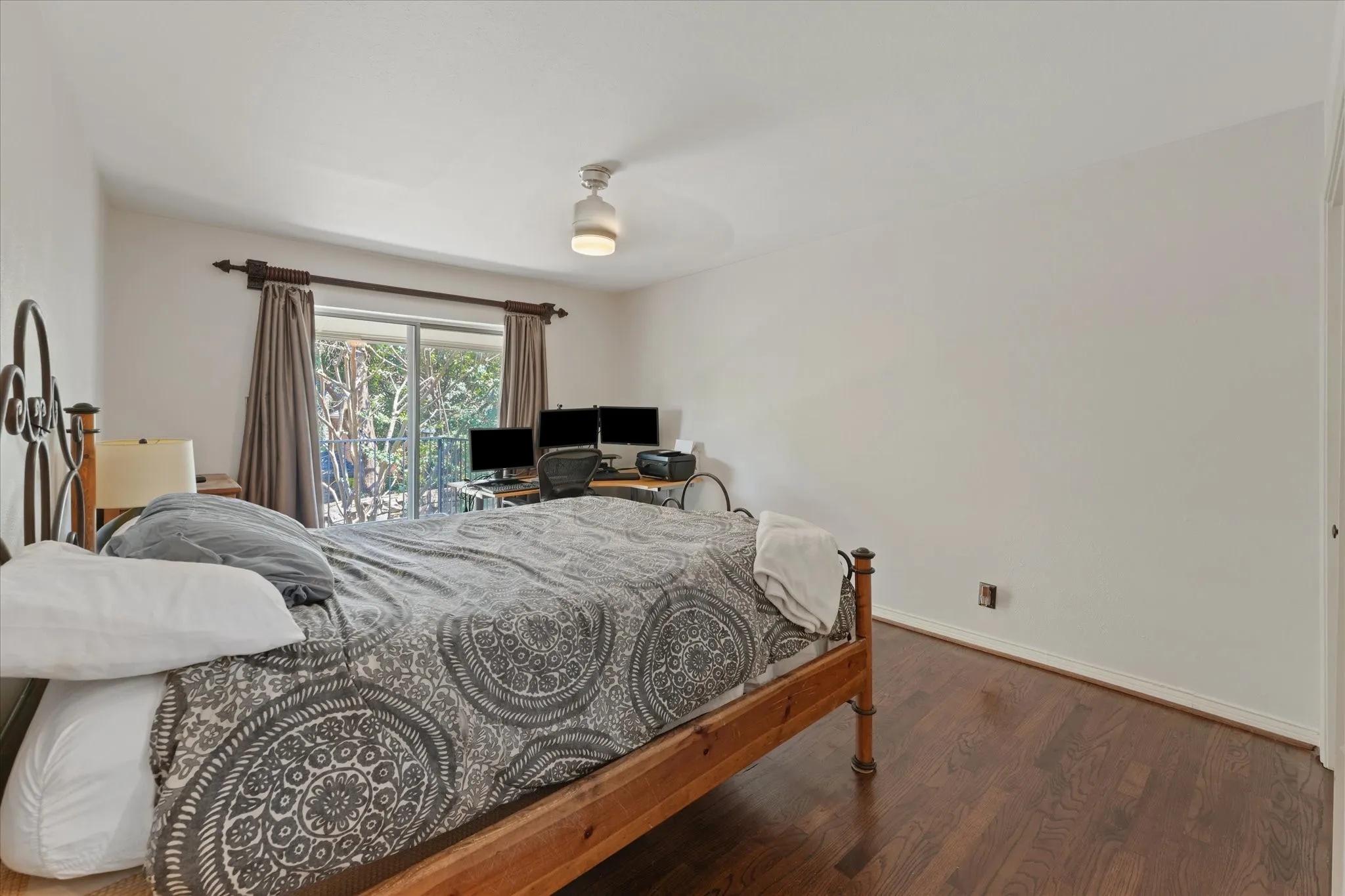 Dark wood-finish flooring with white walls