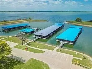 Waterfront property with multiple covered boat slips and extensive dock structures