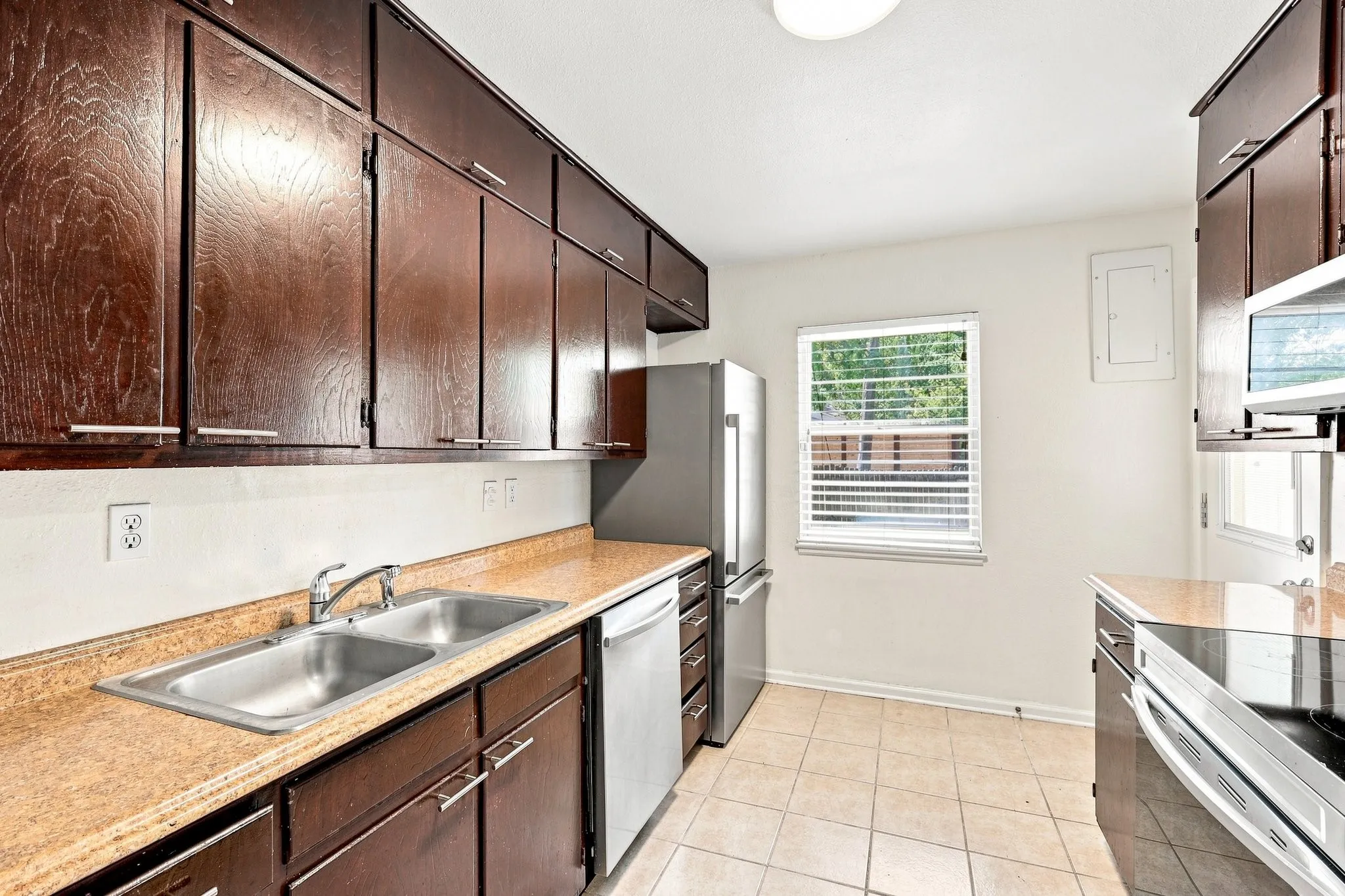 Includes refrigerator and pantry for storage.