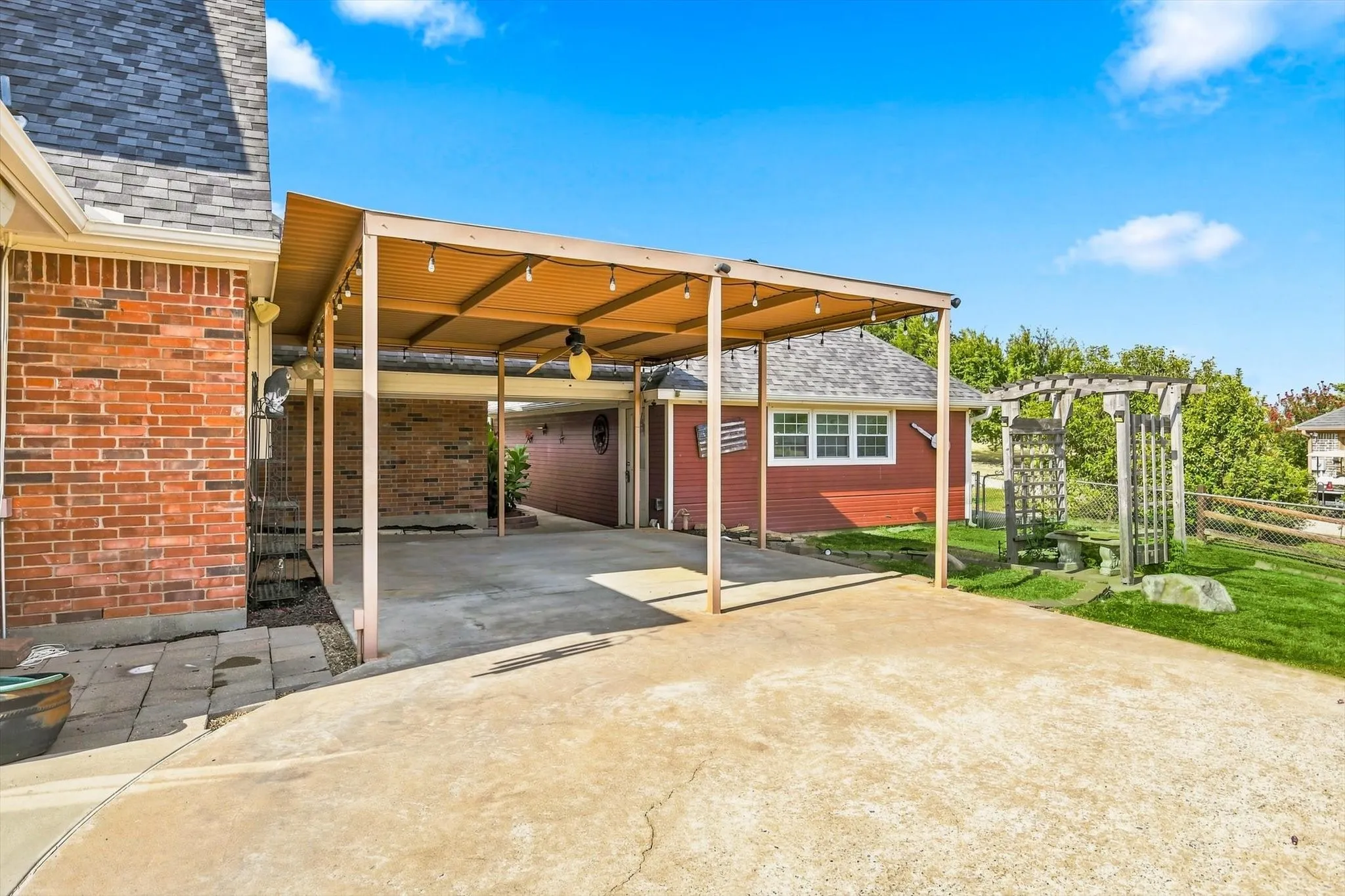 Patio is perfect shade for hot days. Chilly evening sit by the firepit and rainy days? Enjoy the sound as you relax complete dry.  The detached garage is the ultimate man cave and still room to park cars if needed.
