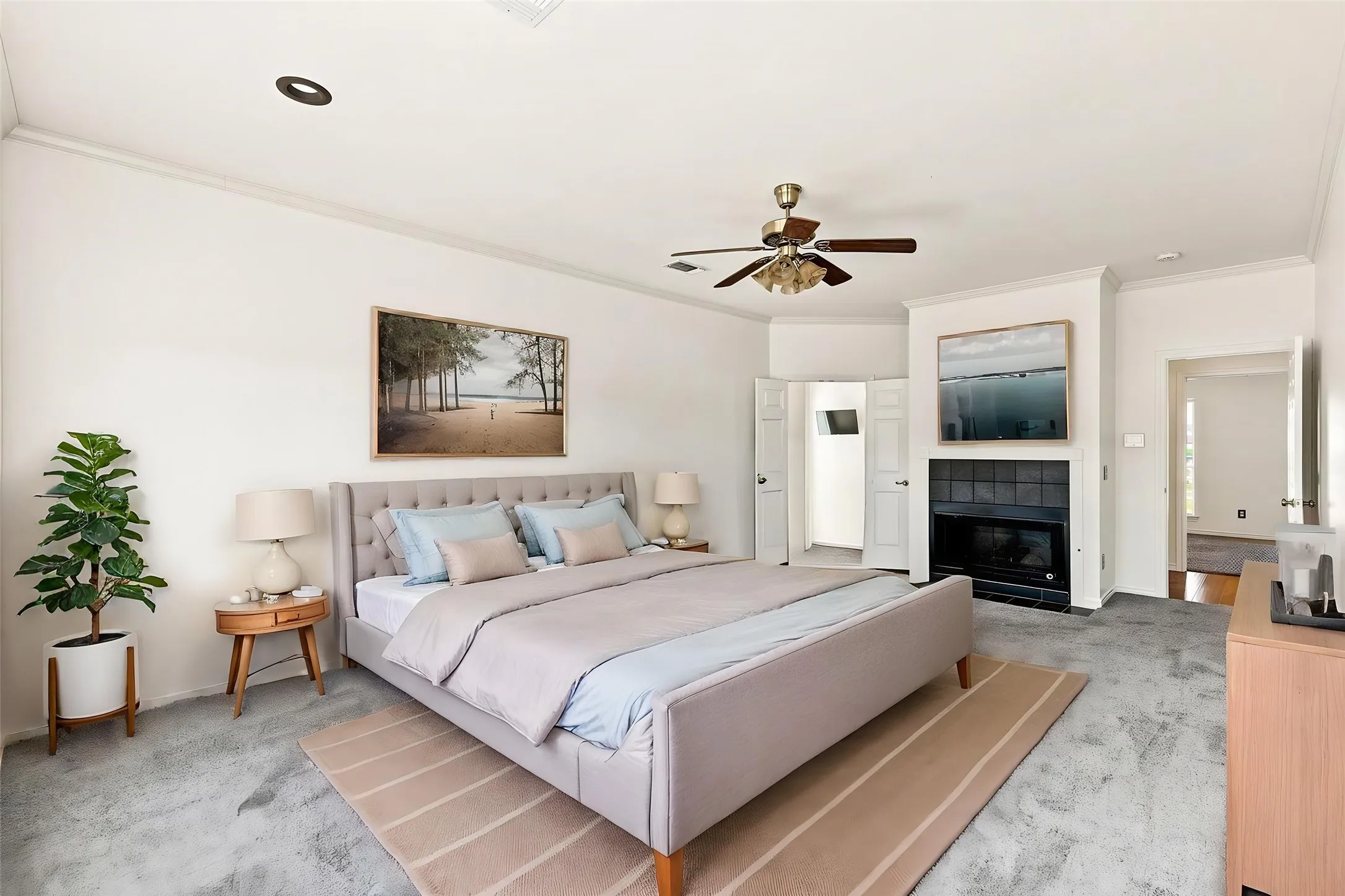 Large Primary with door to exterior back patio. Cozy fireplace
