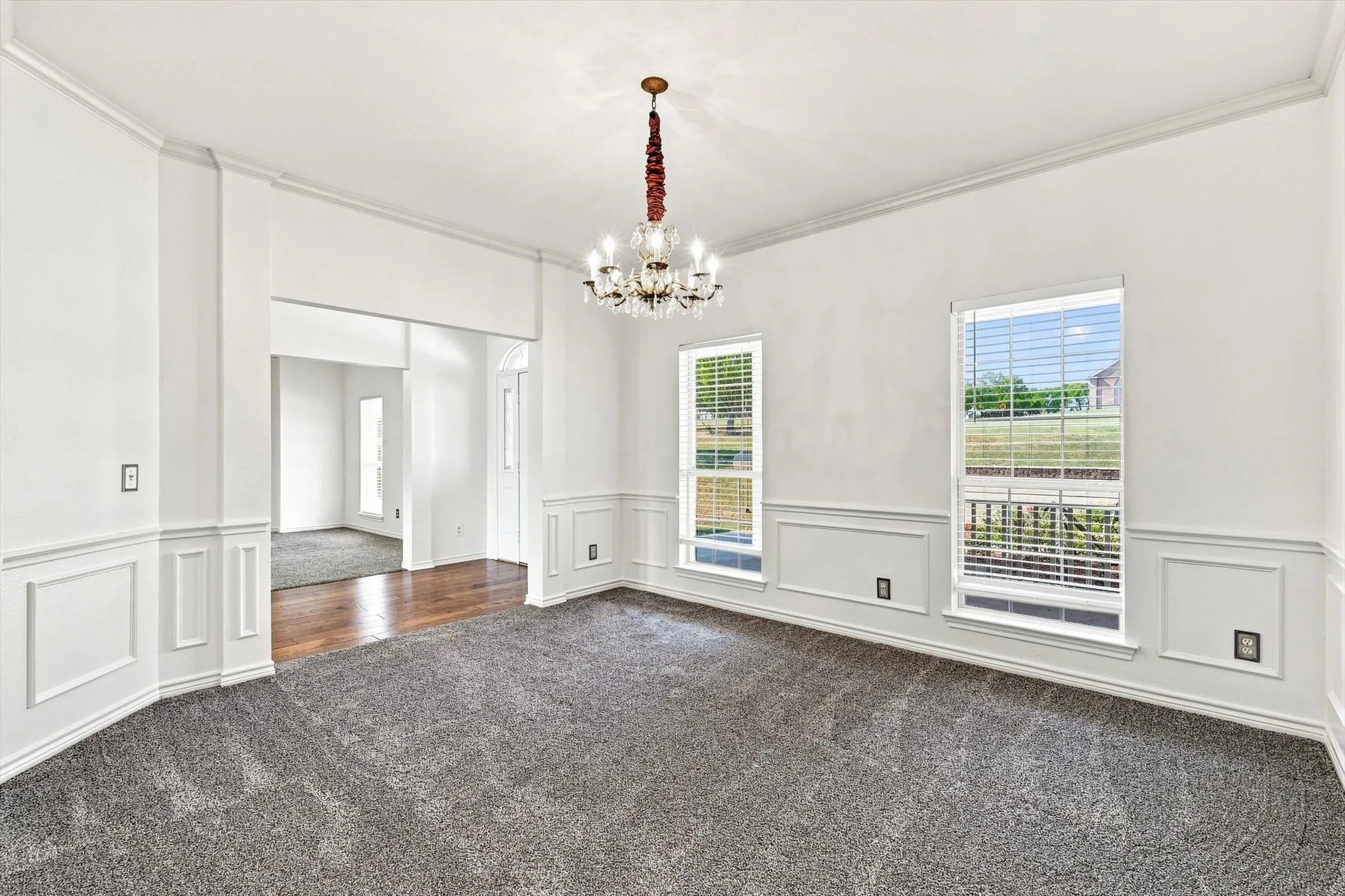 Wonderful exterior view, new carpet and paint. Perfect for large dining or a flex space for additional living.