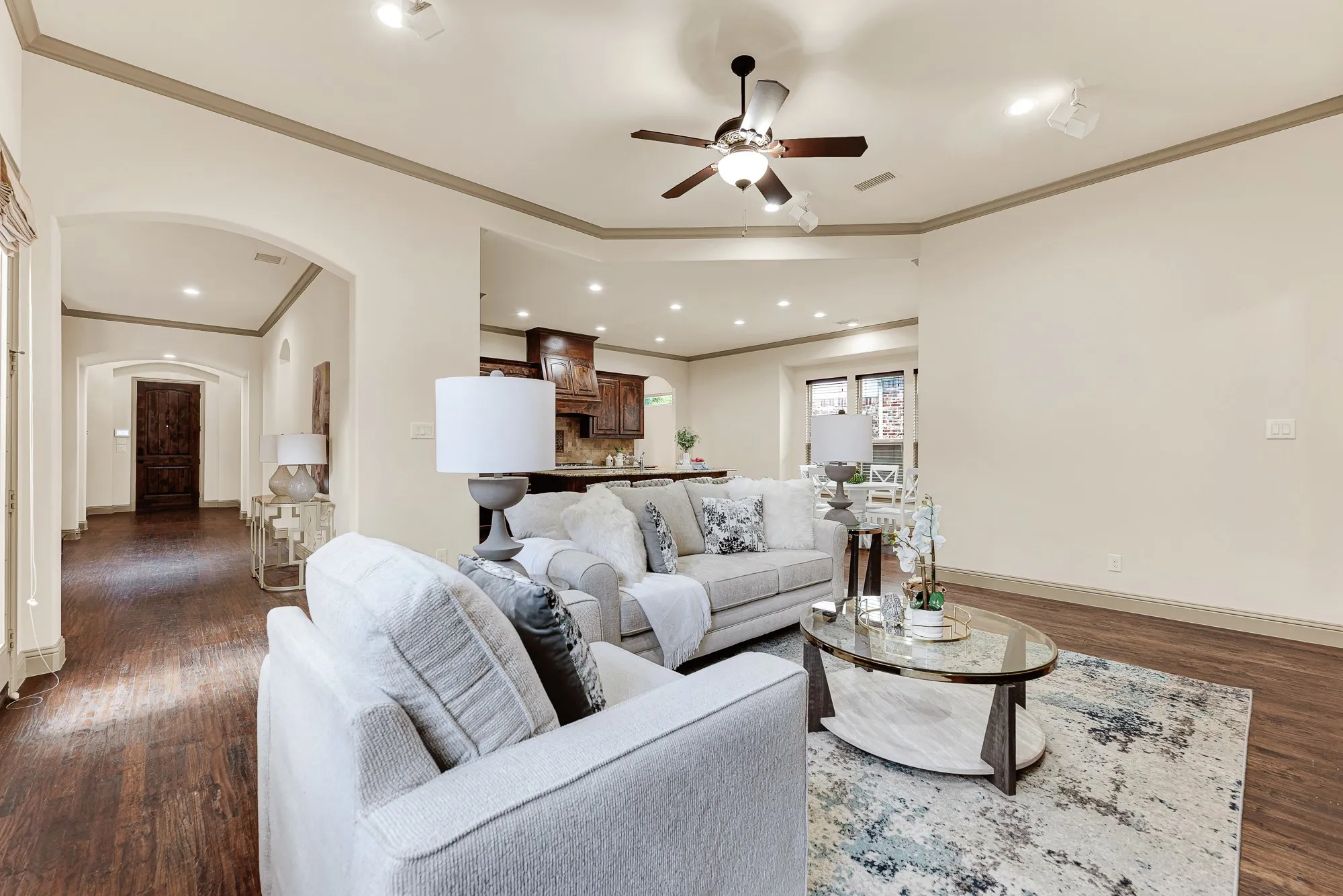Sweeping sightlines through the wide hall provide an effortless transition across the entire main level. Imagine hosting game nights where everyone stays connected, from the sofa lounge all the way to the breakfast bar.