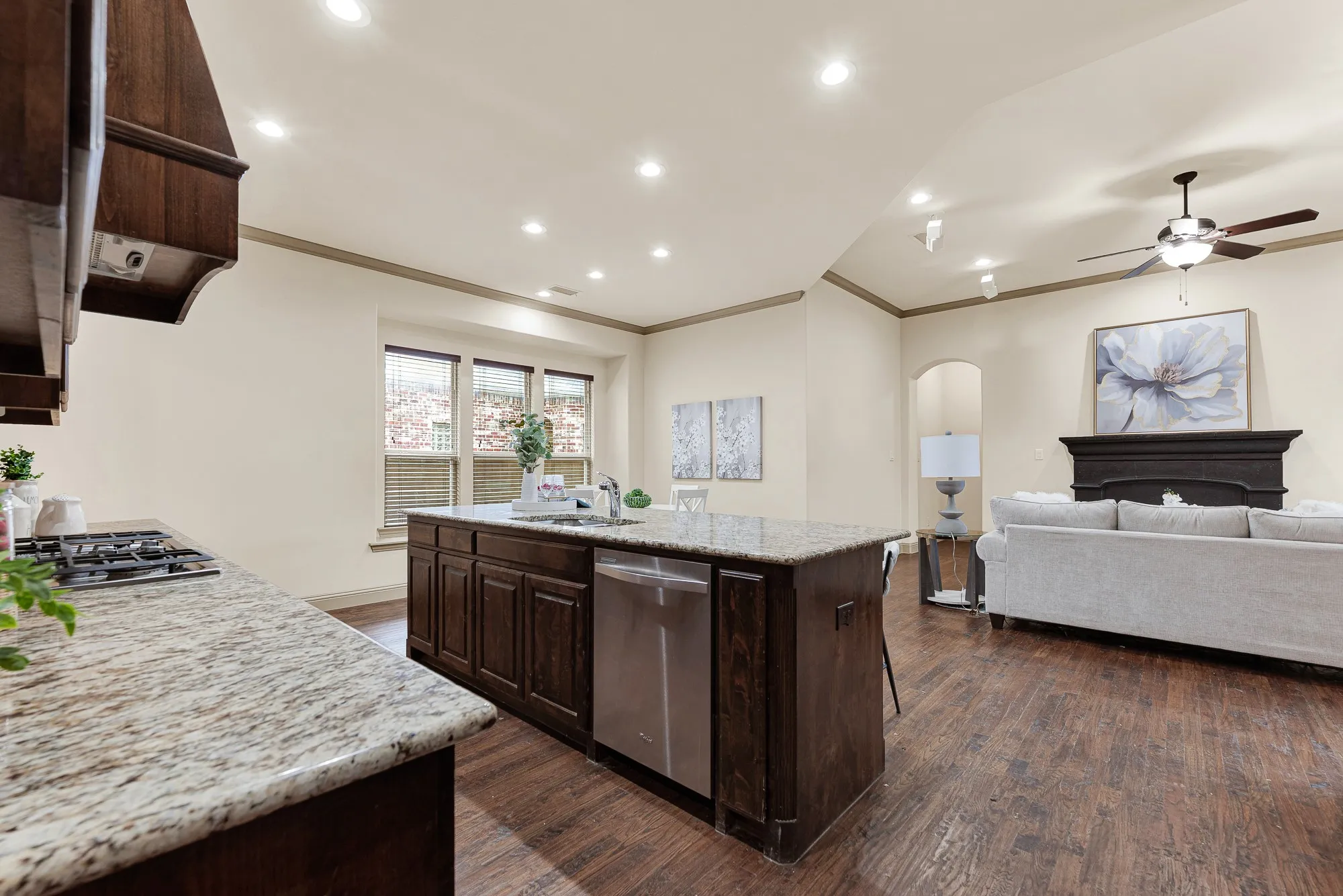 An under-counter stainless dishwasher integrates cleanly into the center island, maintaining sightlines toward the adjacent lounge. Effortlessly rinse plates after dinner while keeping up with lively conversations and movie night just steps away.