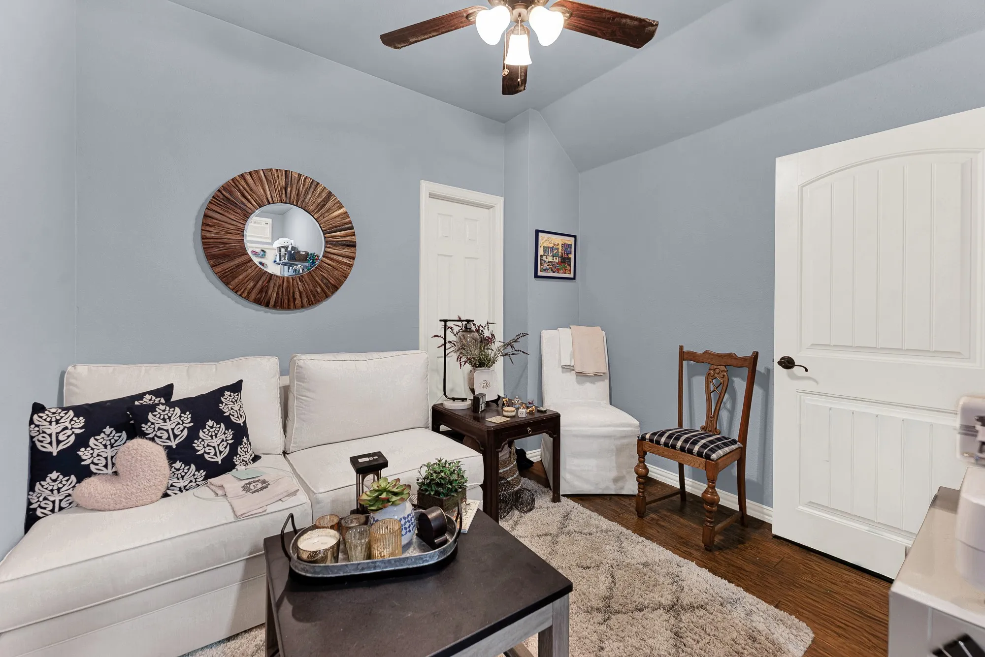 Soft gray walls accentuate the cozy architectural nooks, creating a secluded retreat tucked away upstairs. Retreat here for a peaceful evening escape to catch up on favorite shows or unwind.