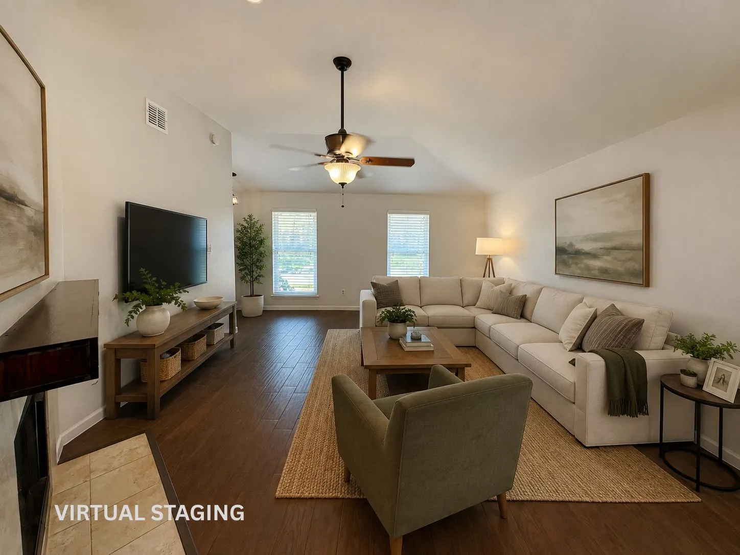 Vaulted ceiling with a ceiling fan, recessed lighting, wood-finish flooring, two windows with blinds, and a fireplace with a tile hearth