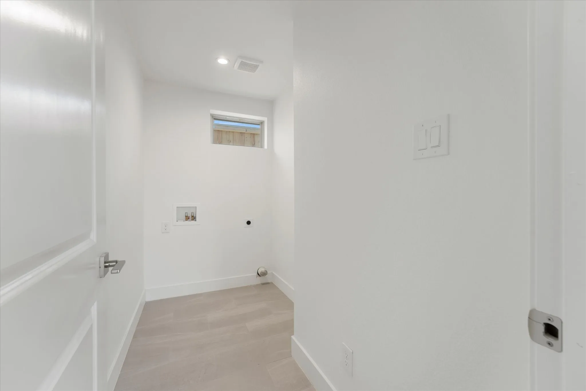 White interior paint with light wood-finish flooring