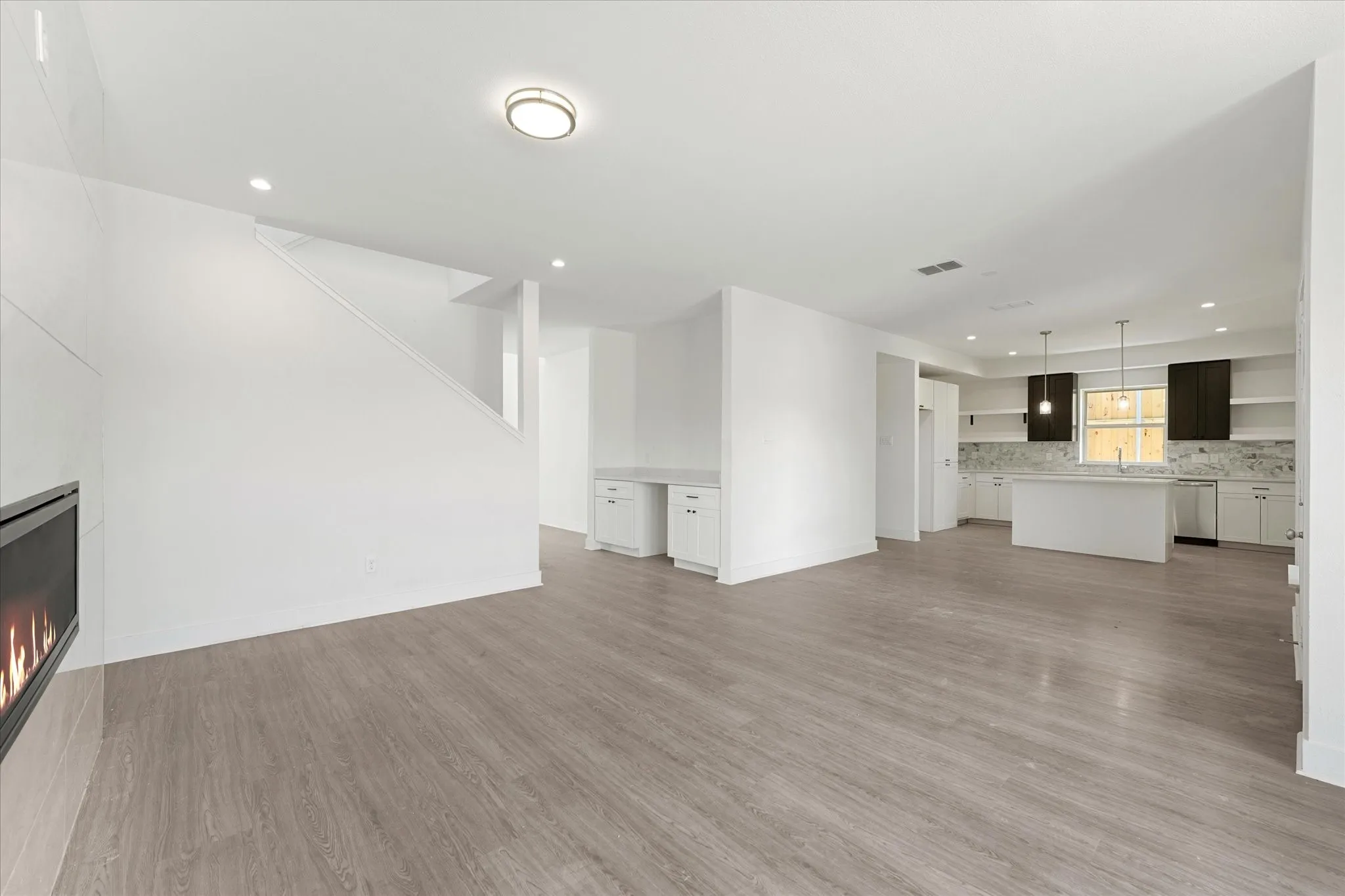 Wood-finish flooring throughout the main living space