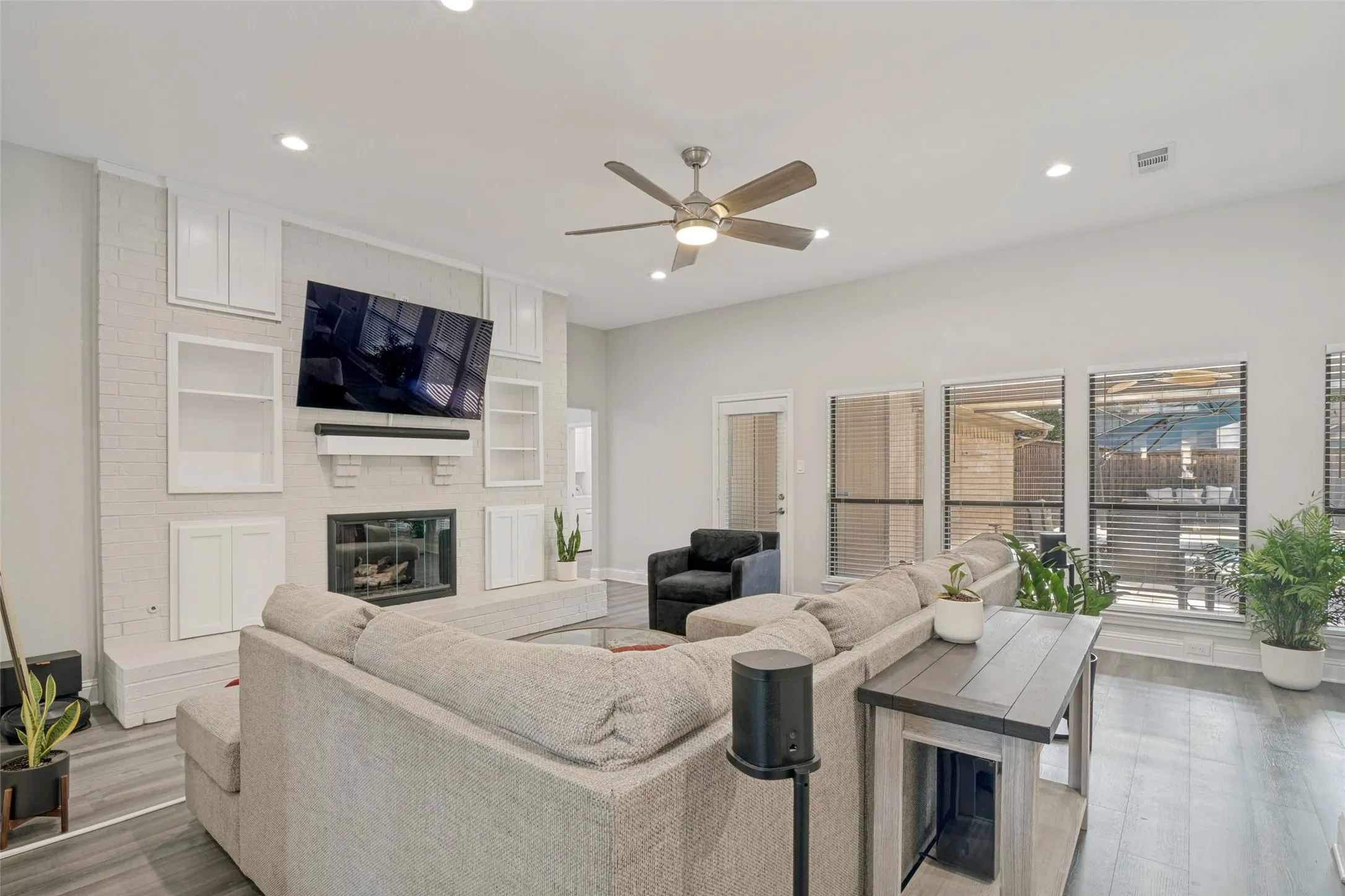 Living room also has view of the pool and door to get outside