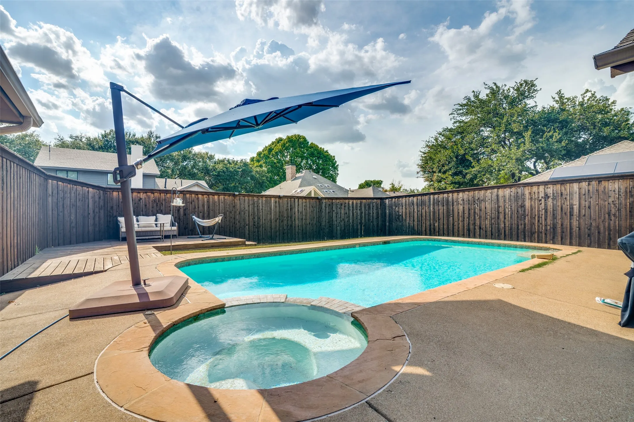 Deck off to side of pool , able to layout or additional space for patio furniture