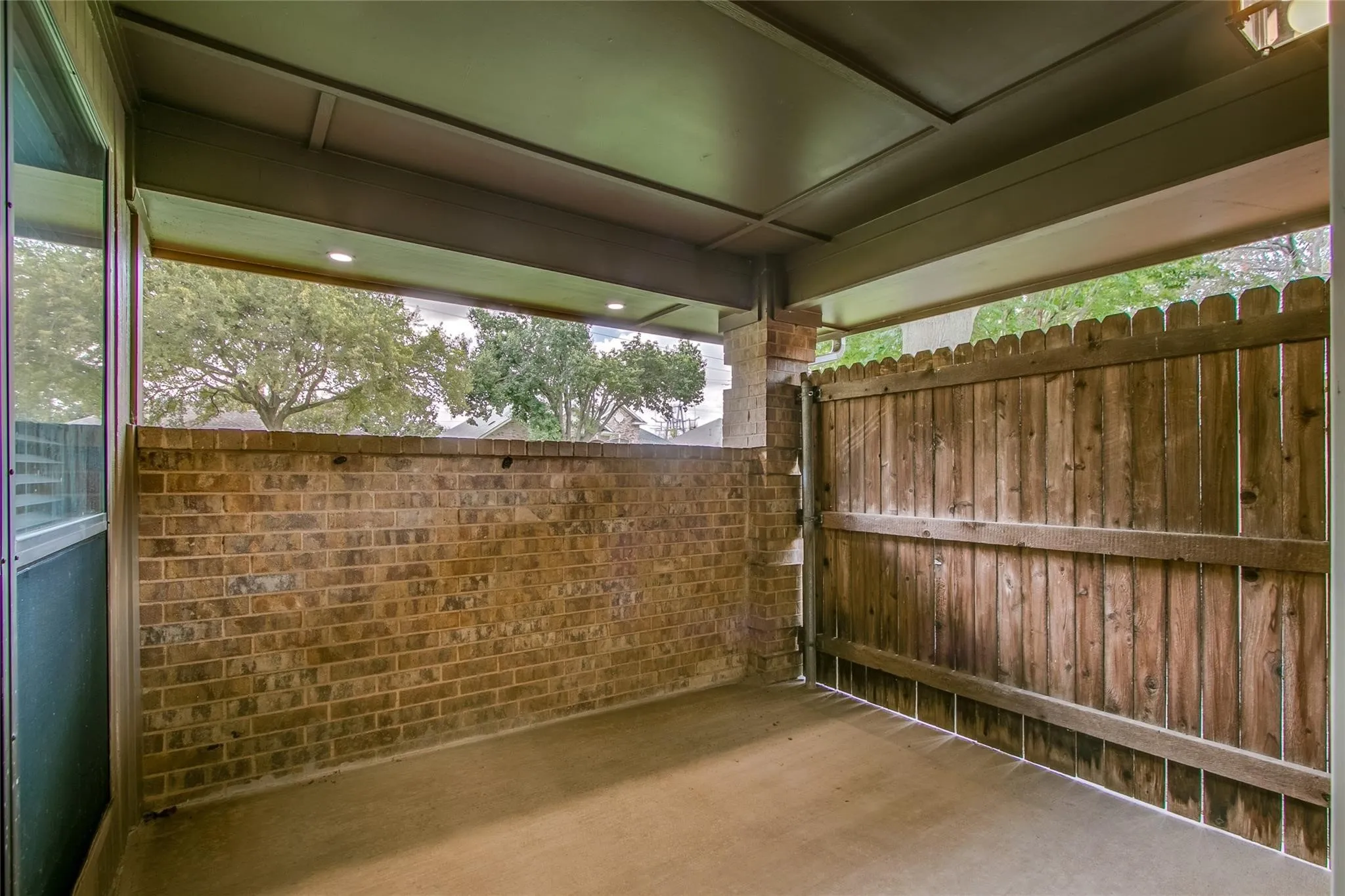 To the left of the homes, second front patio space