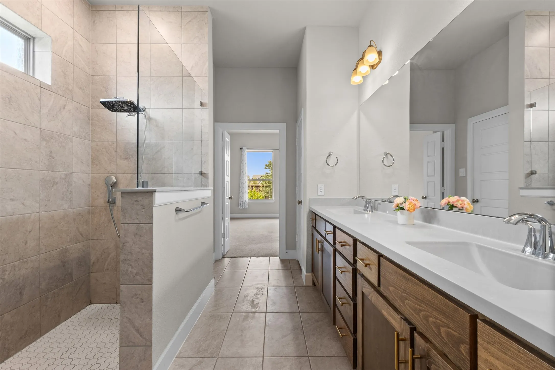 Dual vanity with integrated sinks and wood-finish cabinetry