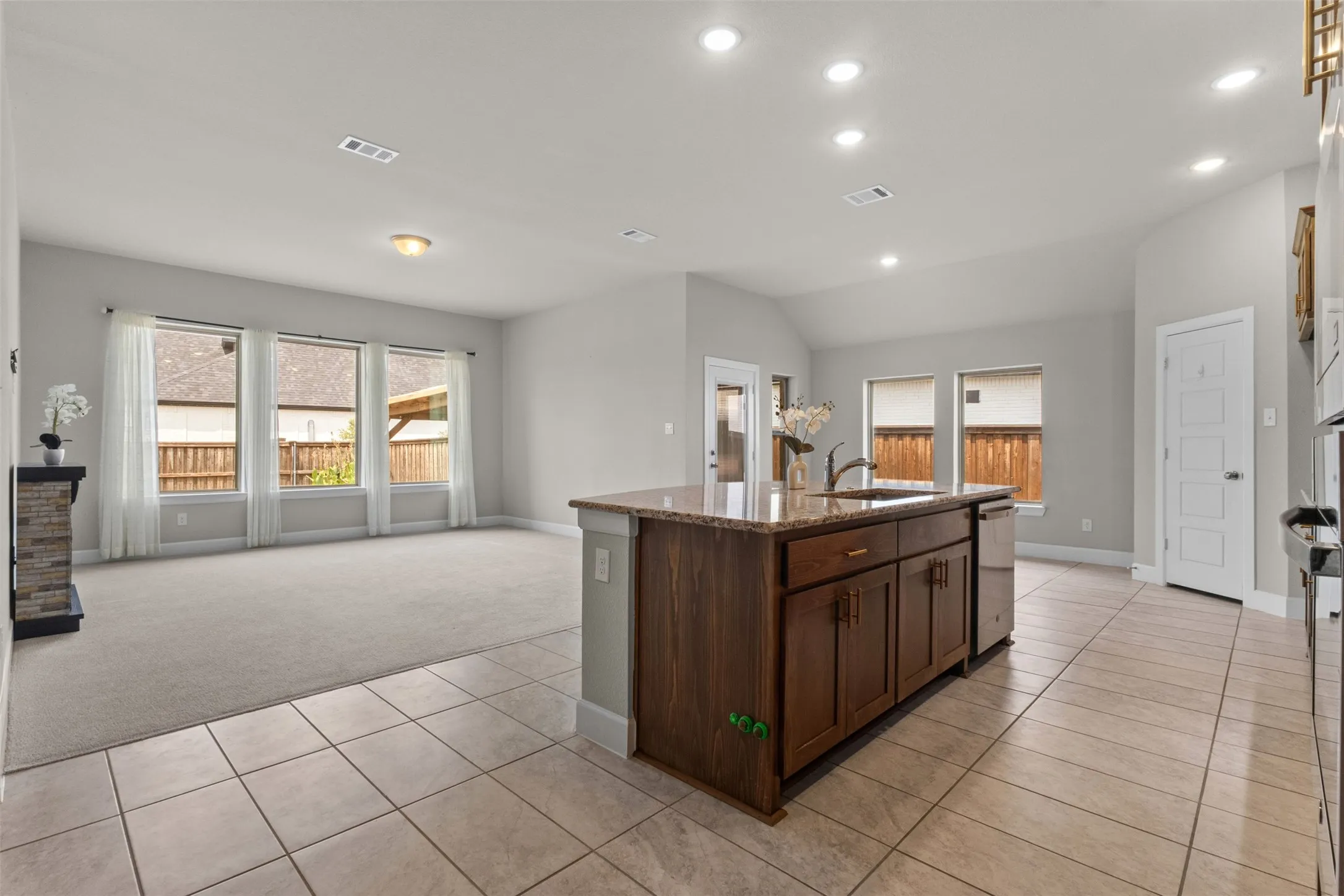 Kitchen island with built-in sink and stainless steel dishwasher