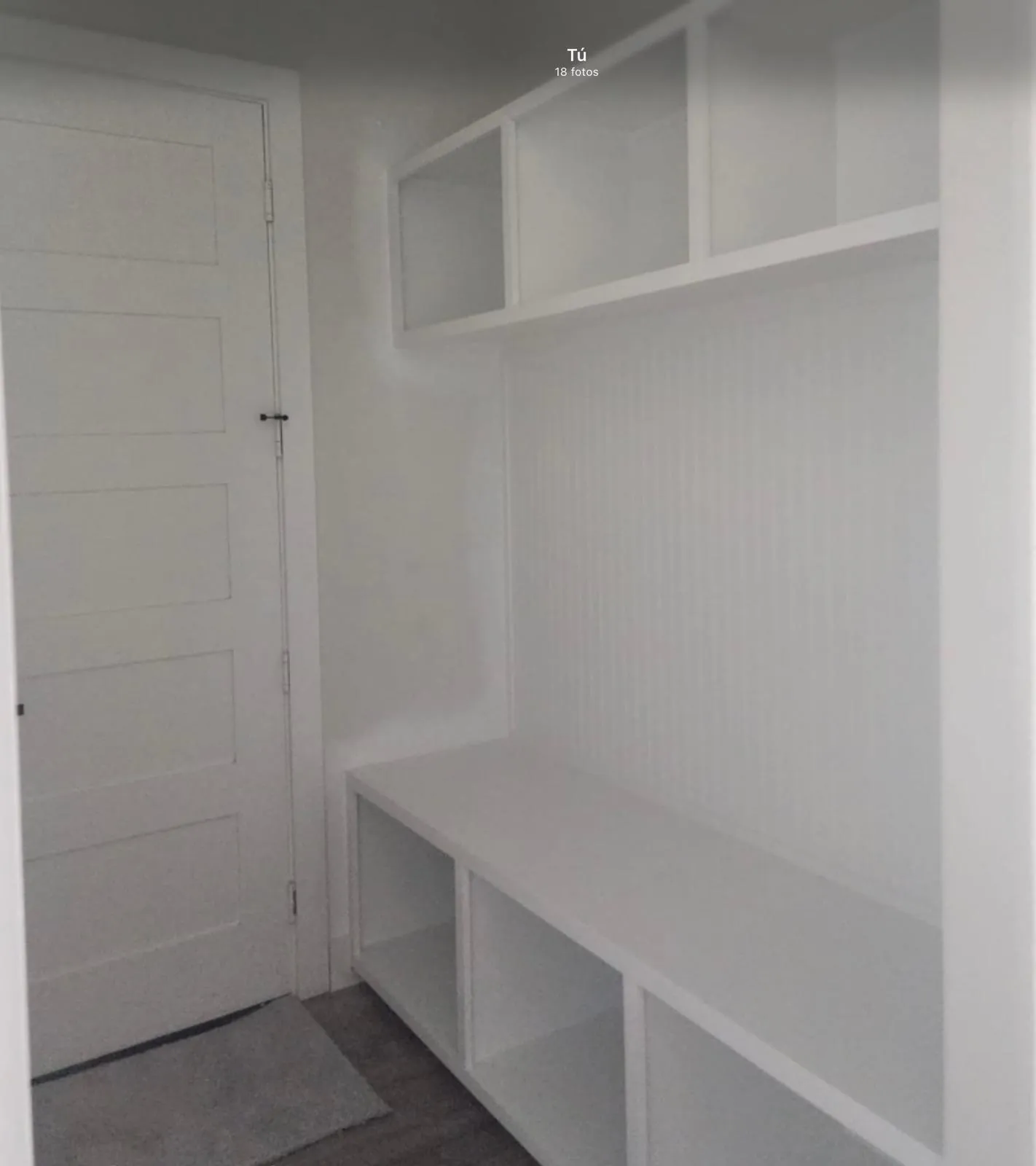 Built-in white cabinetry with beadboard backing, open shelving, and integrated bench seating